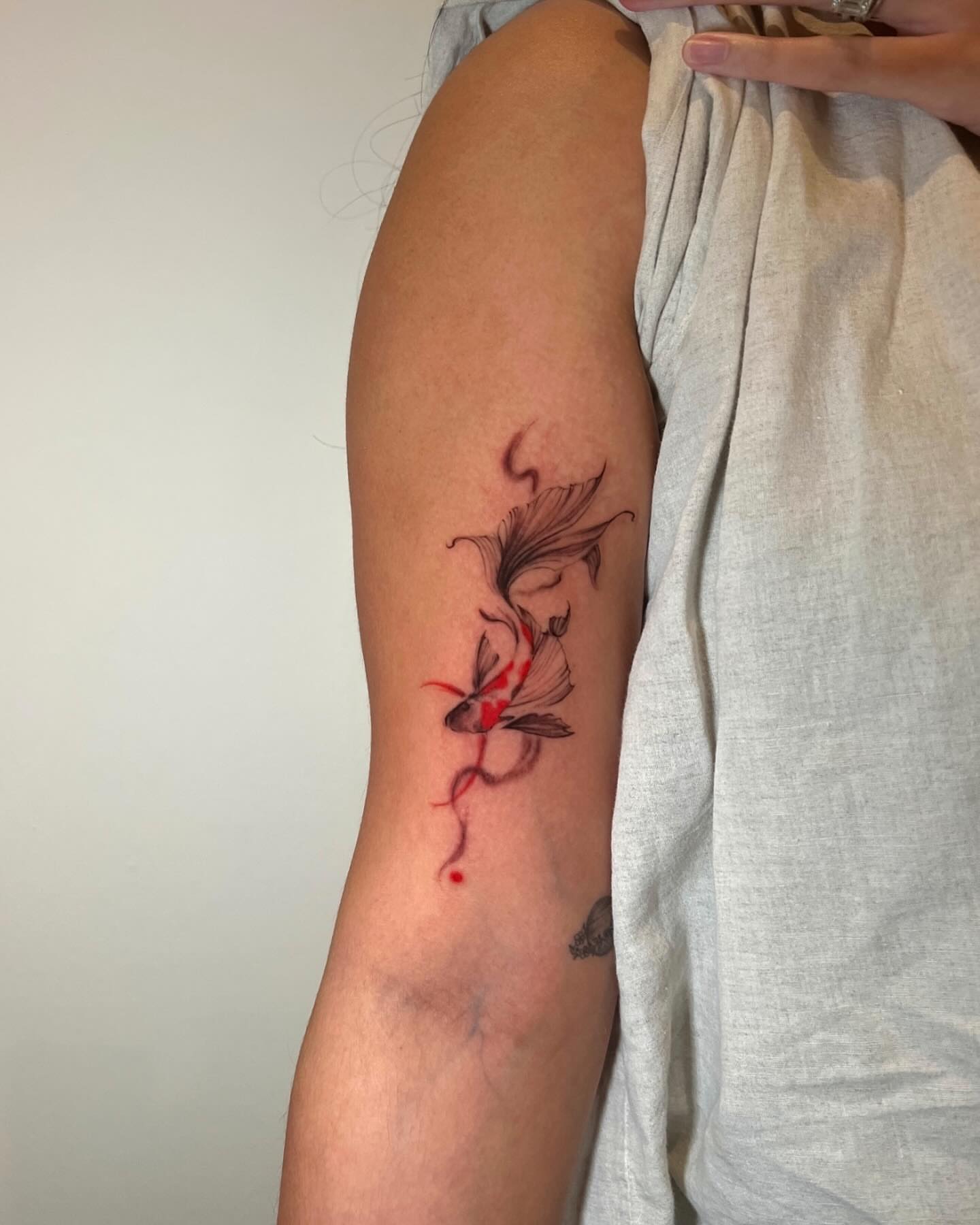 Goldfish watercolor tattoo on the forearm by G̵̨̗̗̈̅̓́͡ĕ̸̡̜̫̾̌̎̈͠ë̷̢̳̤̰̗͈̃͌͒̚͞
