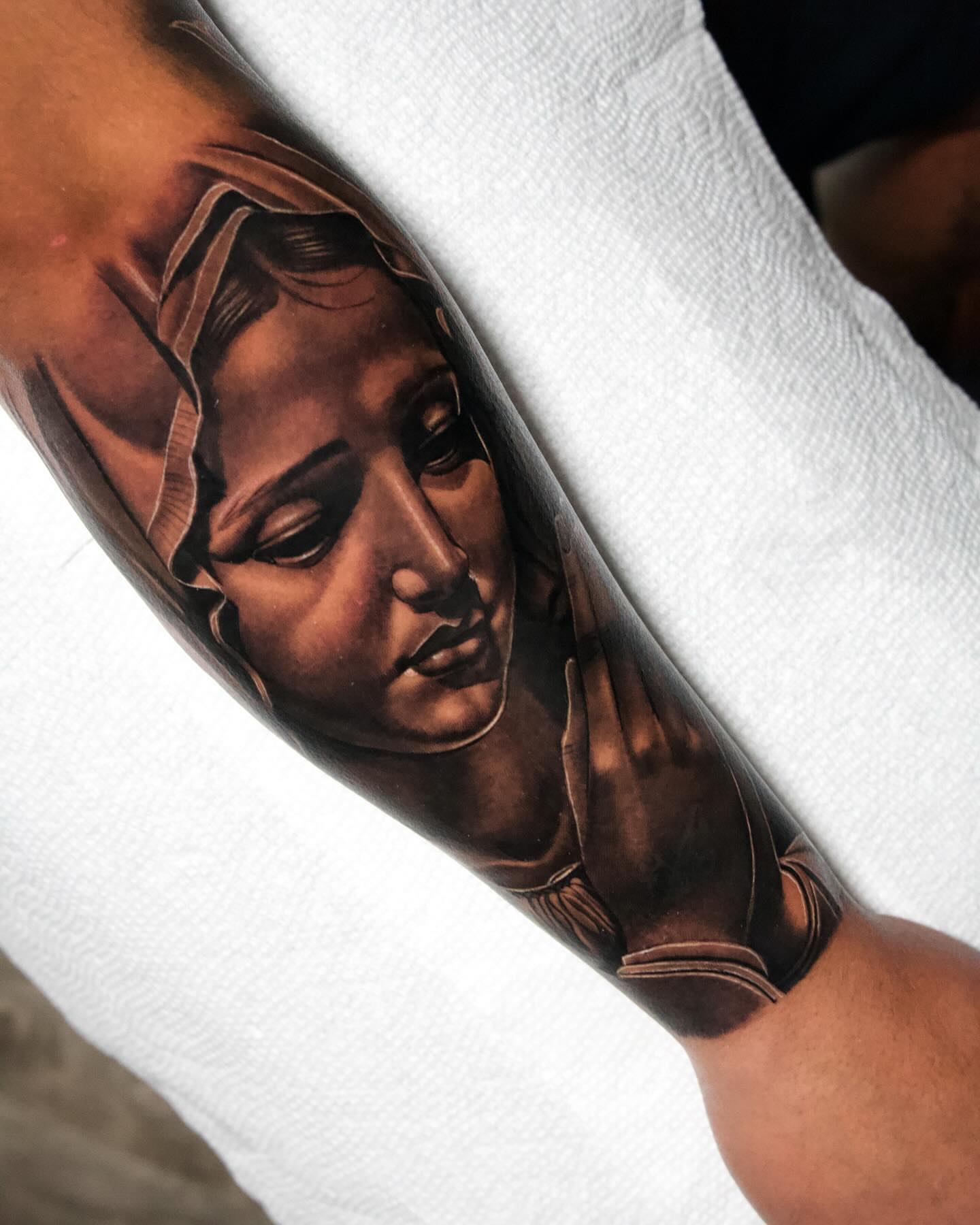 Religious figure realism tattoo on the forearm by Anthony Duran