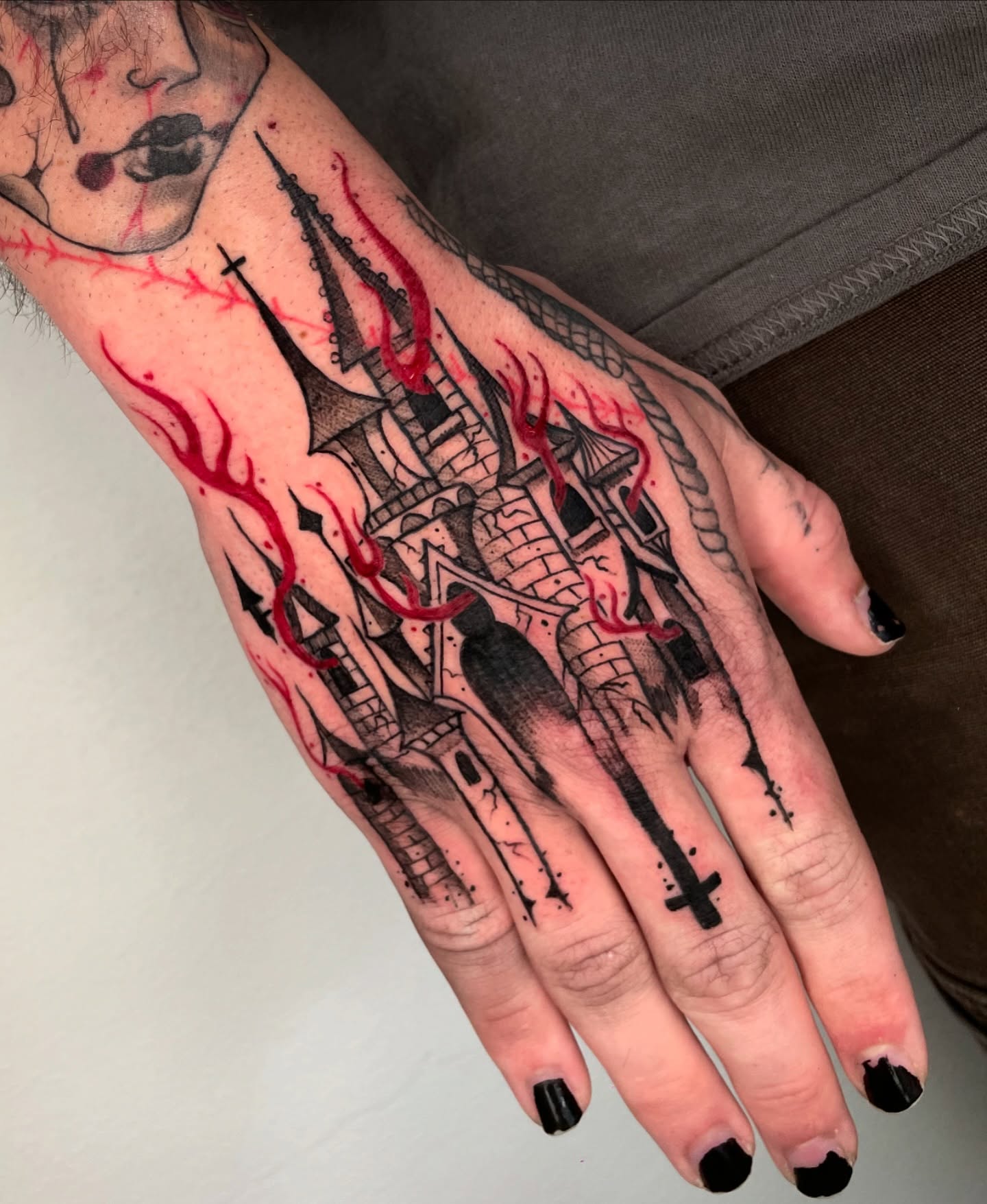 Castle ruins dark realism tattoo on the hand by Kathryn the Tooth Collector