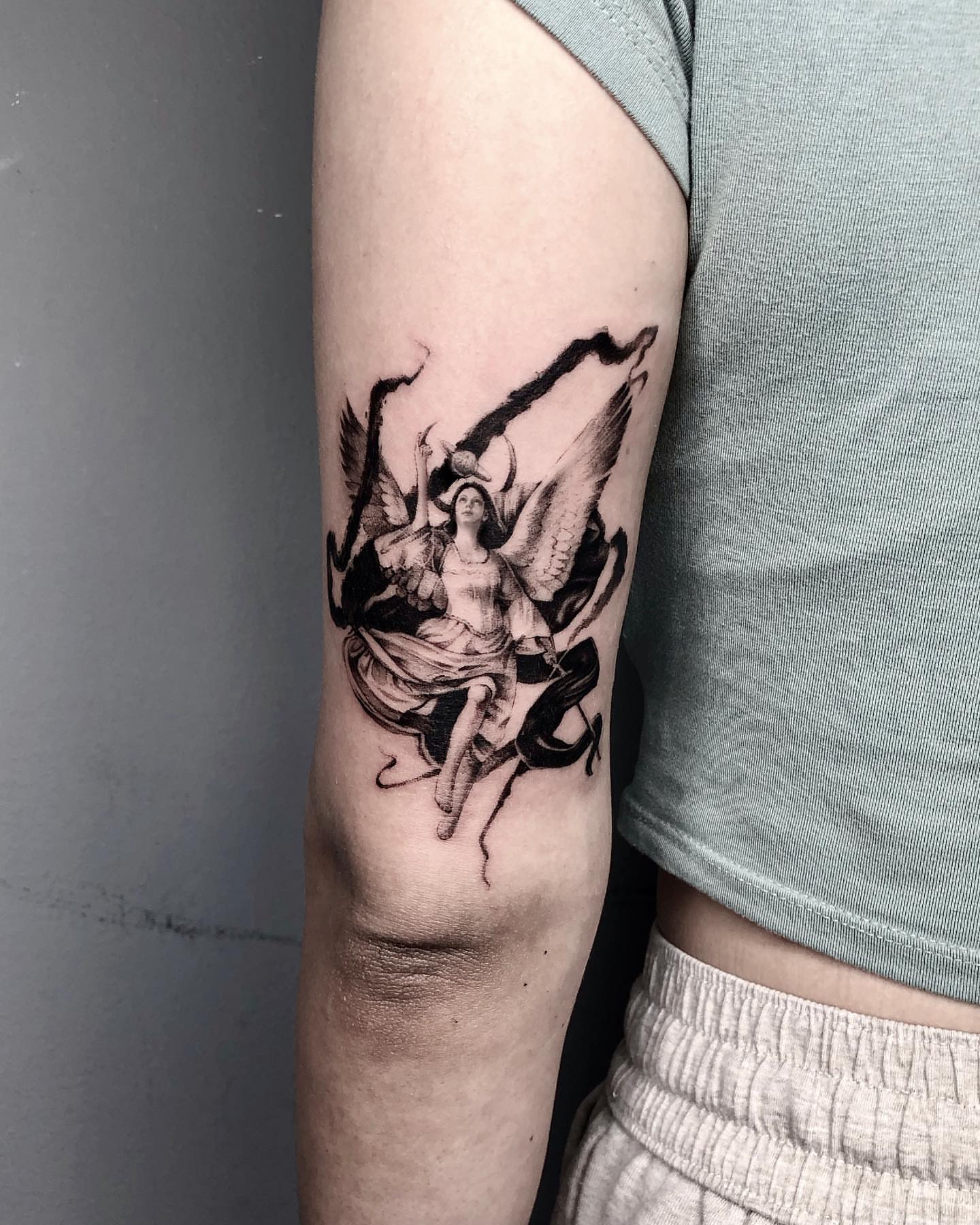Angel with wings realism tattoo on the forearm by Shihao zhao