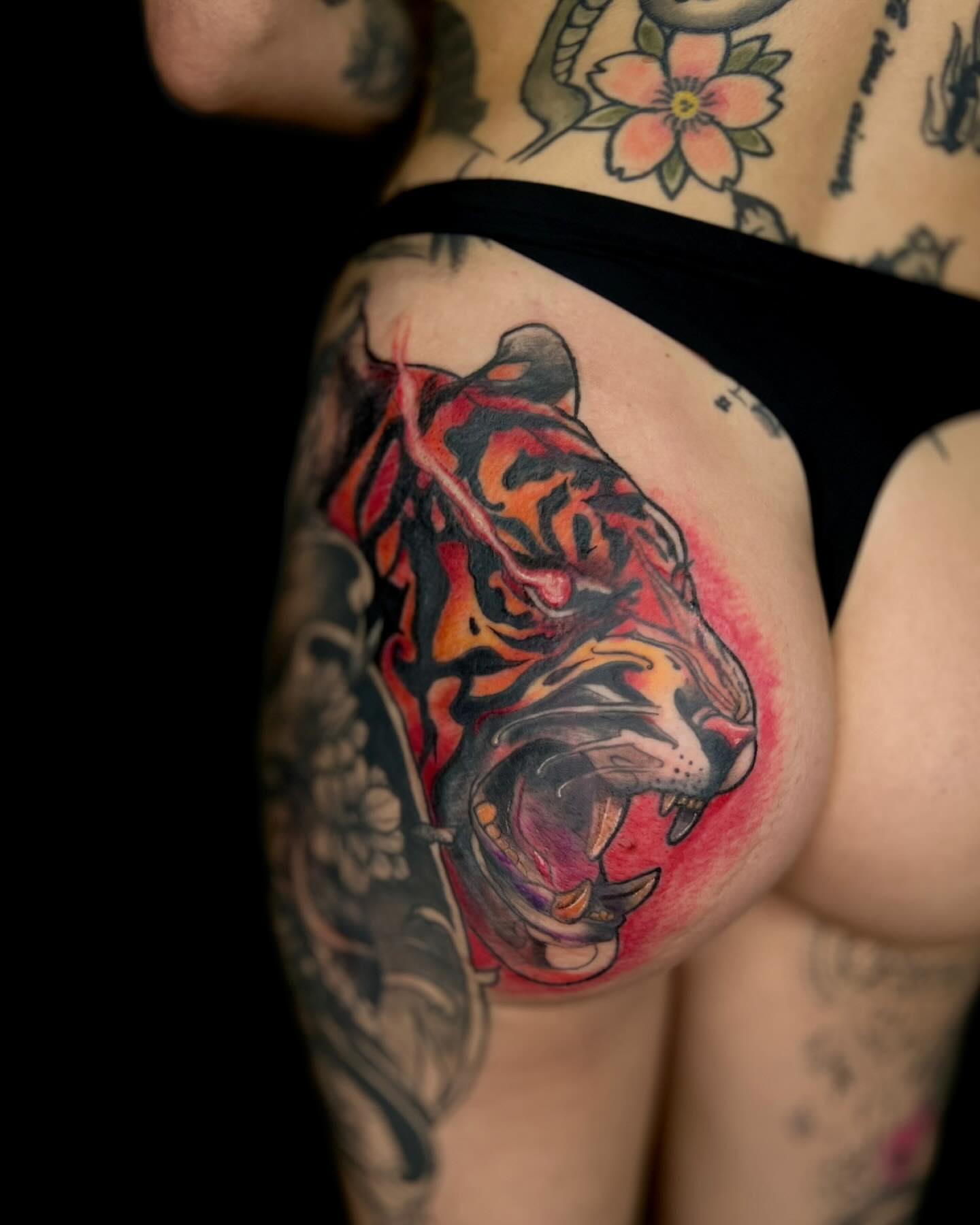 Tiger American traditional tattoo on the thigh by Asia Rene Tattoos👑
