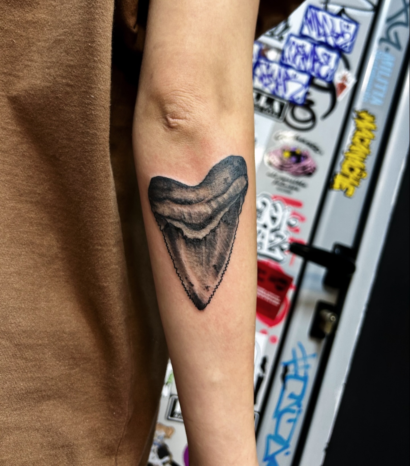 Shark tooth black and grey tattoo on the forearm by Comastein__________✍🏼️