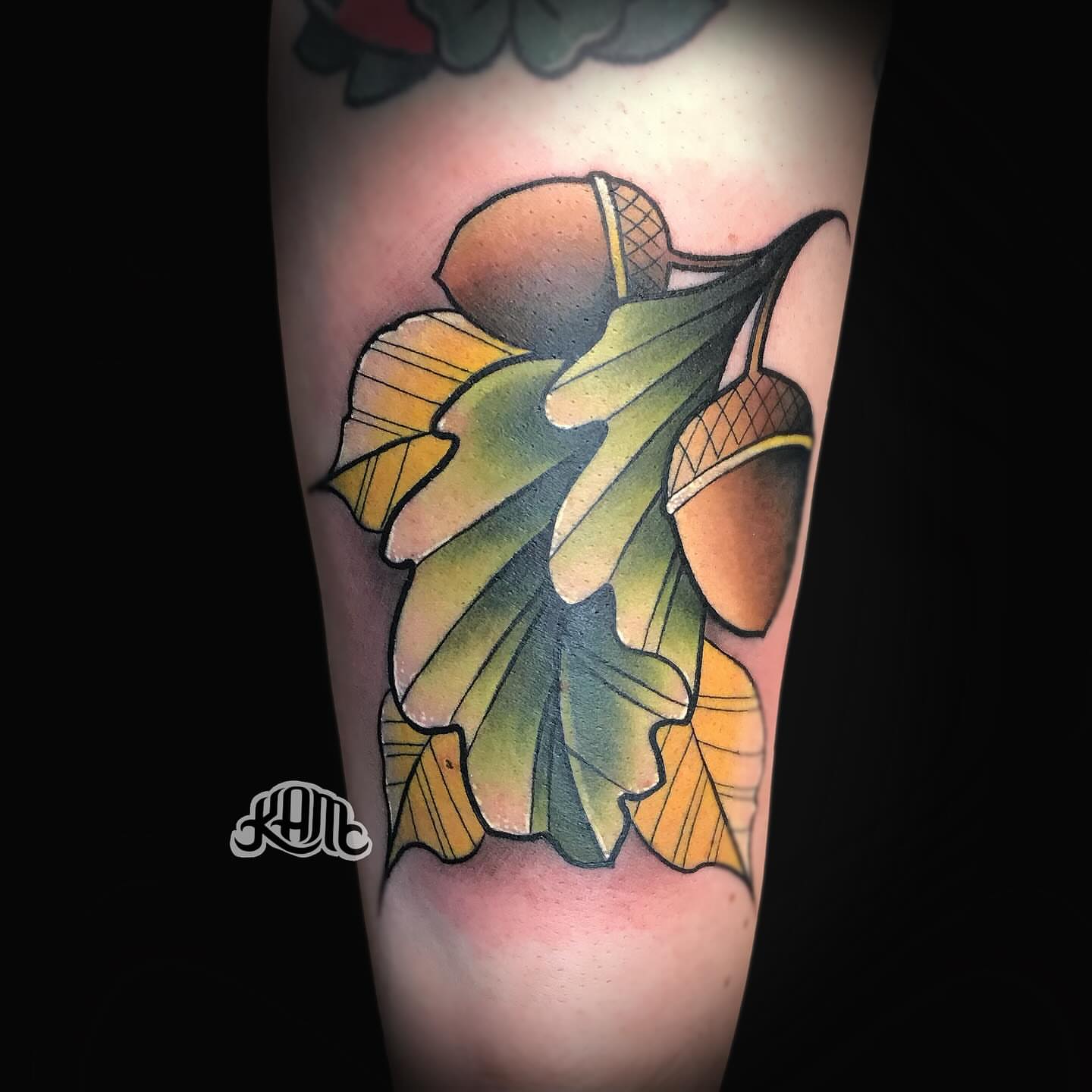 Acorns and oak leaves American traditional tattoo on the forearm by Keith (KAM) Miller