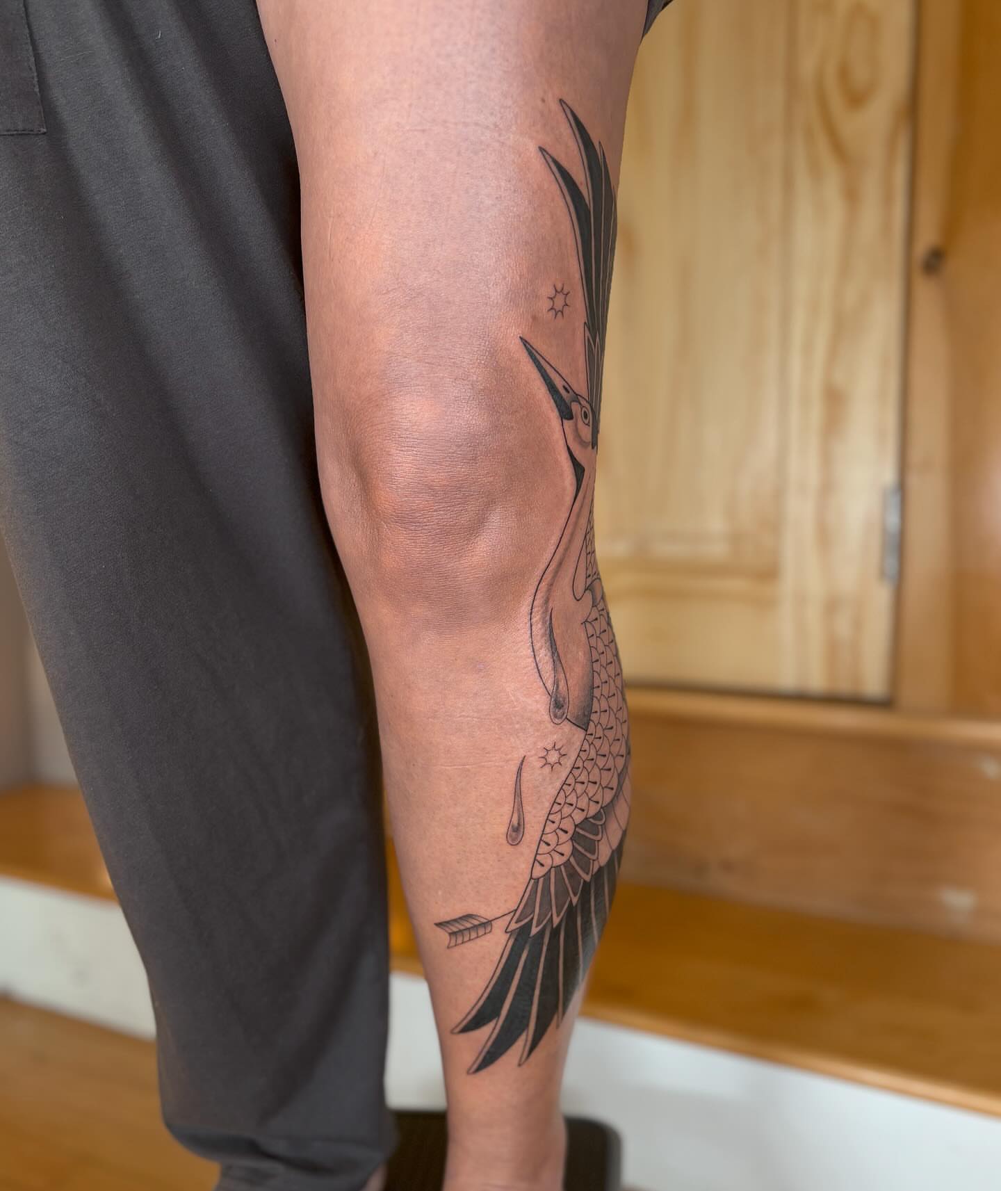 Heron black and grey tattoo on the forearm by Anna Sage