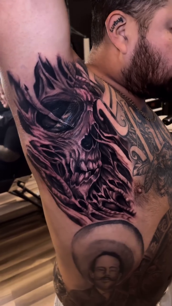 Tattoo by @igor.blackrhino — dark_realism, black_and_grey