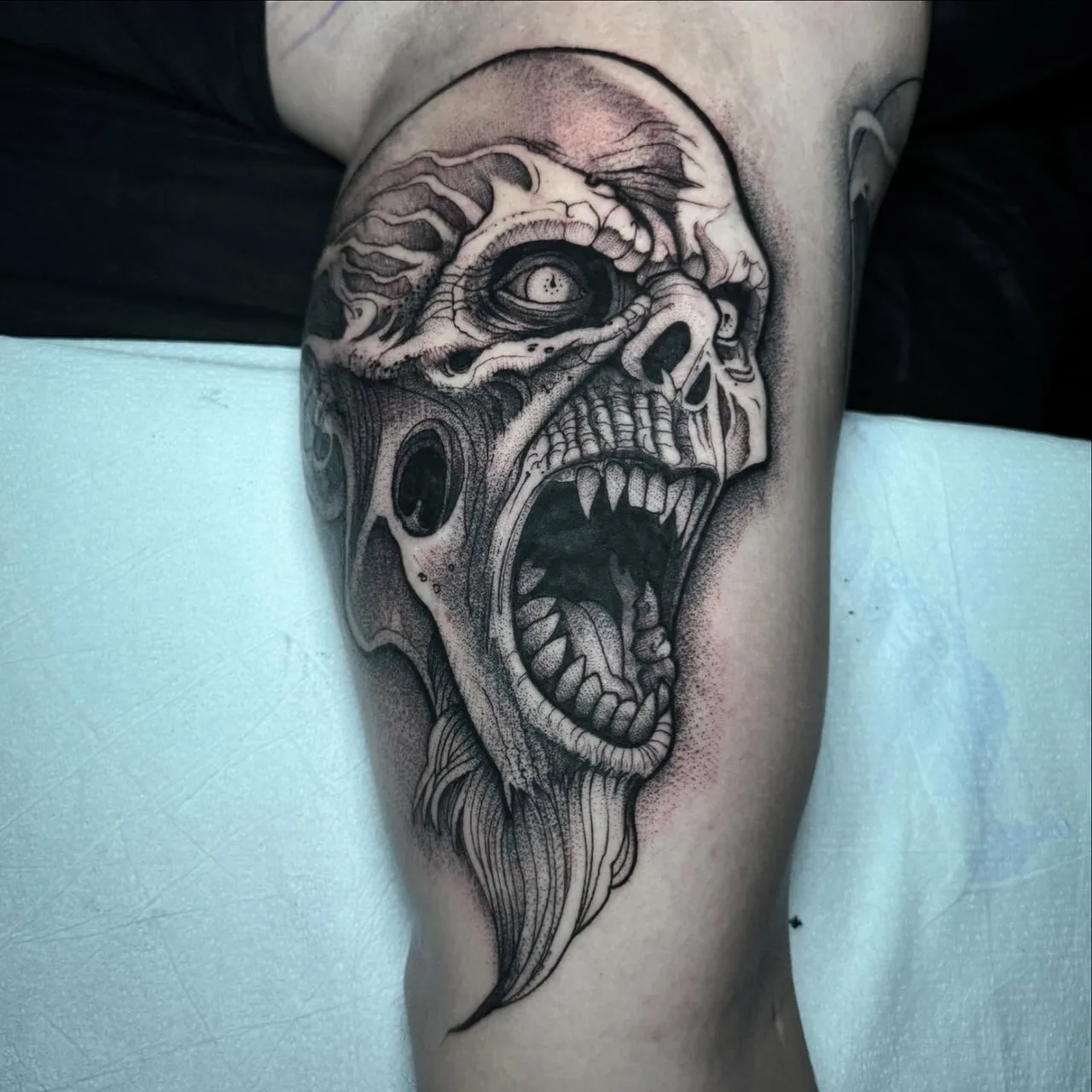 Screaming zombie head dotwork tattoo on the forearm by David Mushaney