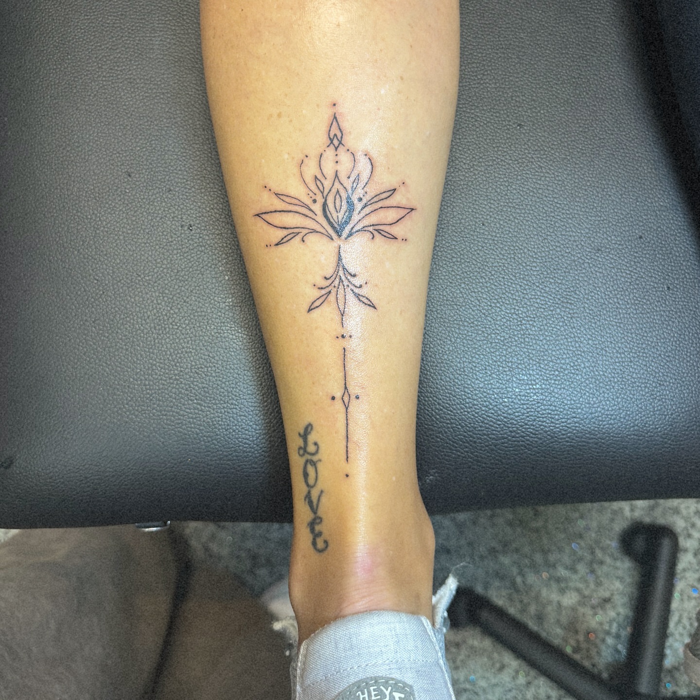 Lotus flower geometric tattoo on the forearm by Lindsay