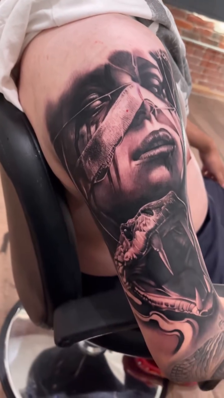 Woman and snake realism tattoo by Erick Gutierrez, Las Vegas, Nevada