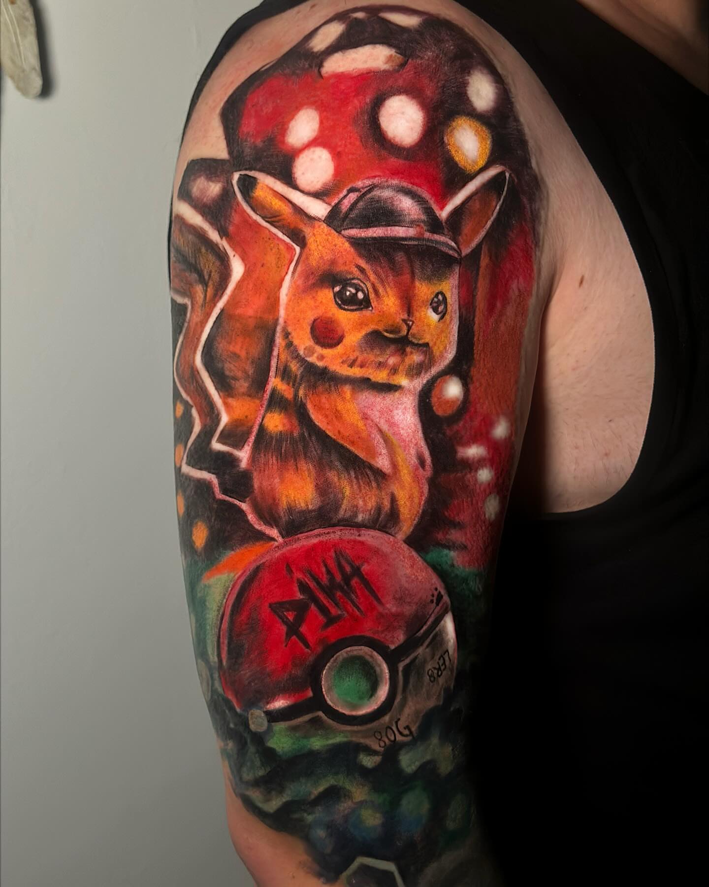 Pikachu realism tattoo on the upper arm by Anghel Patricia