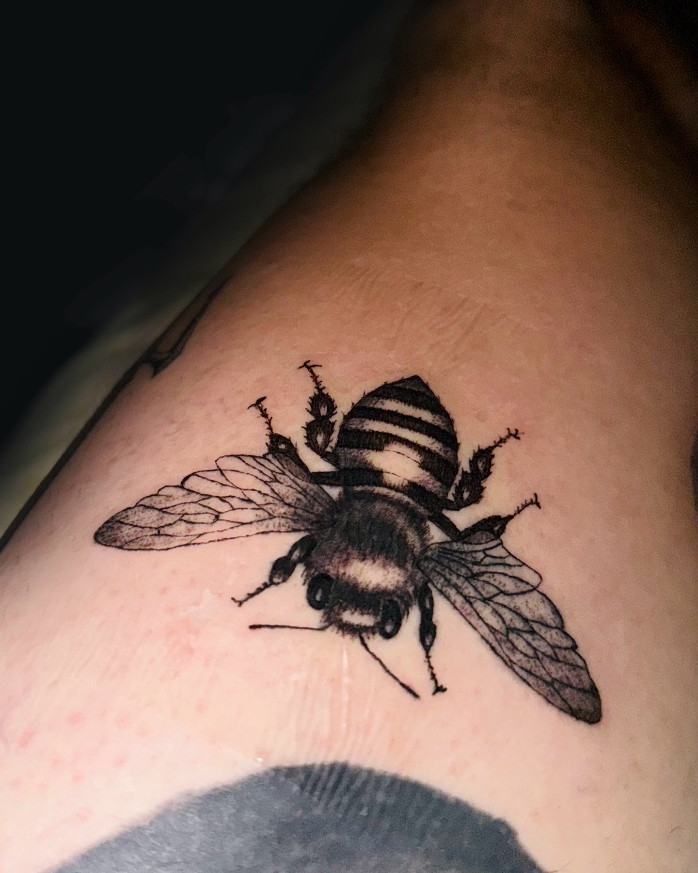 Bee black and grey tattoo on the thigh by Tattoo Artist ⚔️ San Diego, CA