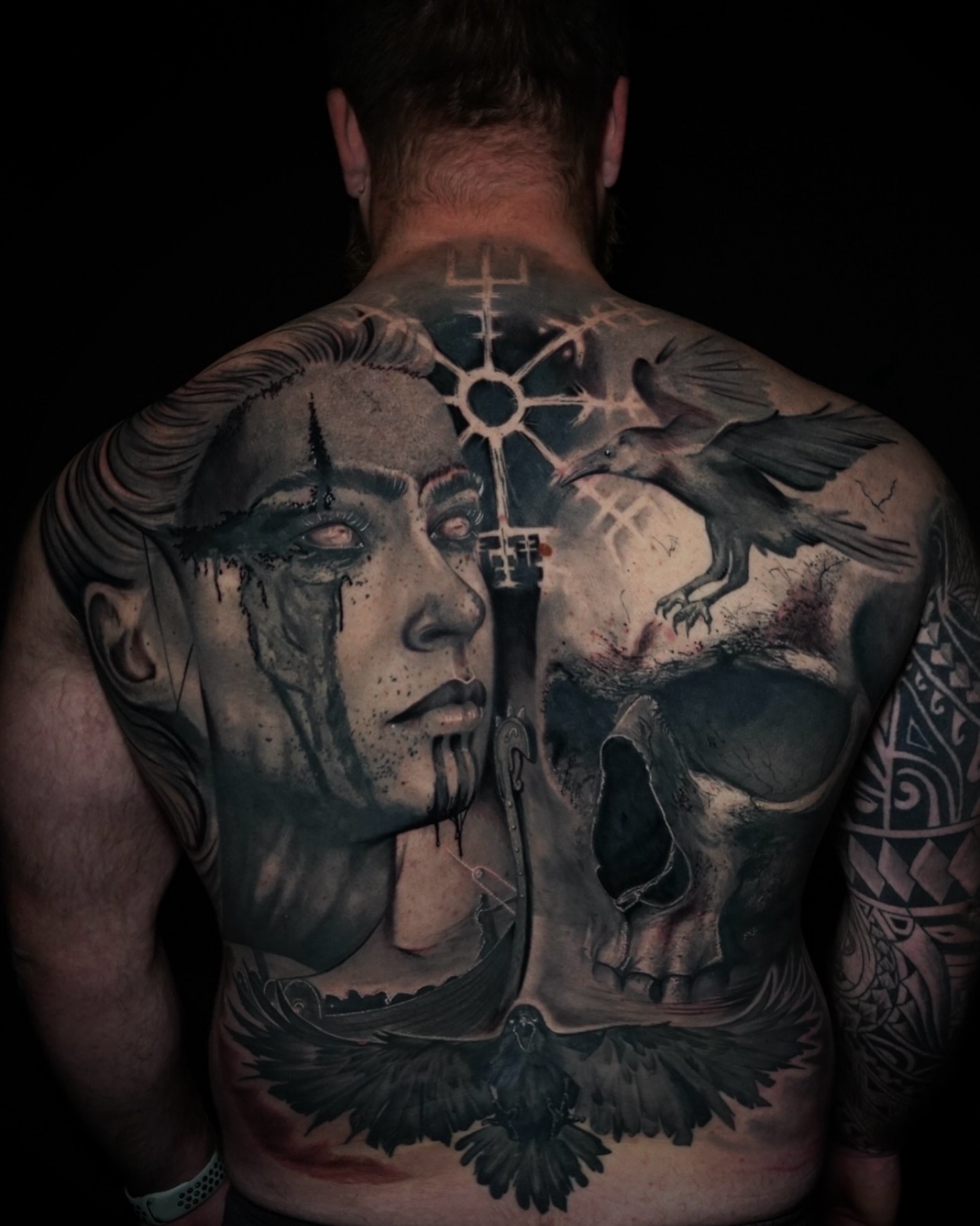 Woman's face and skull realism tattoo on the back by JoannaTattoos