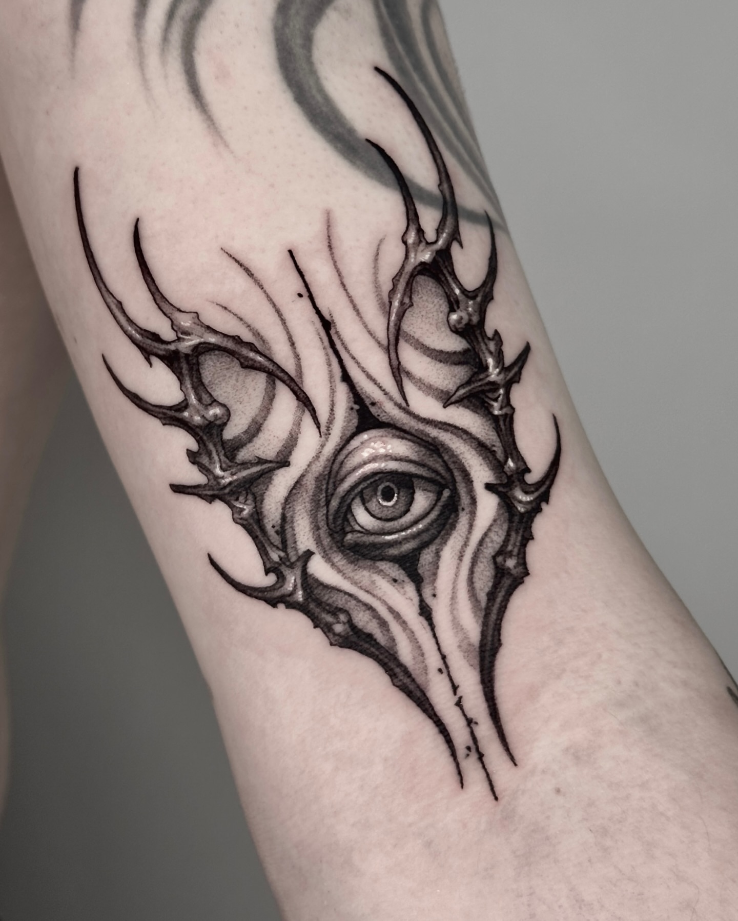 Eye with antlers realism tattoo on the forearm by 두식