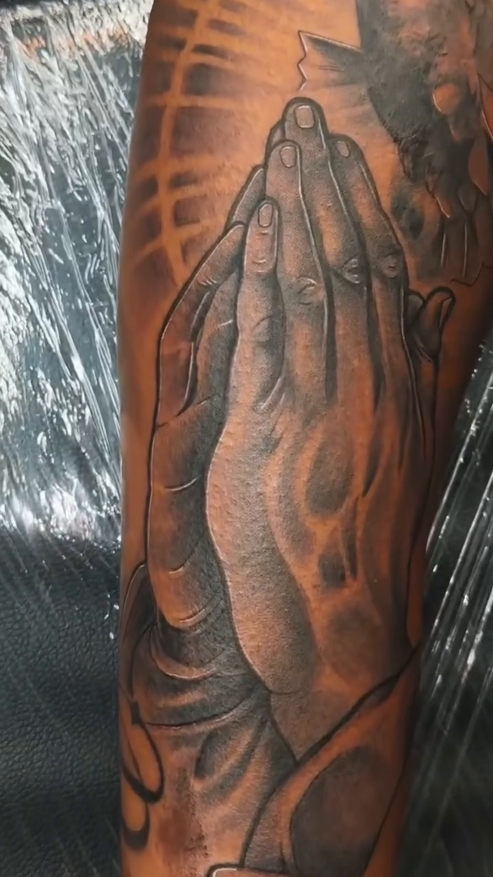 Praying hands realism tattoo by Anwon Johnson