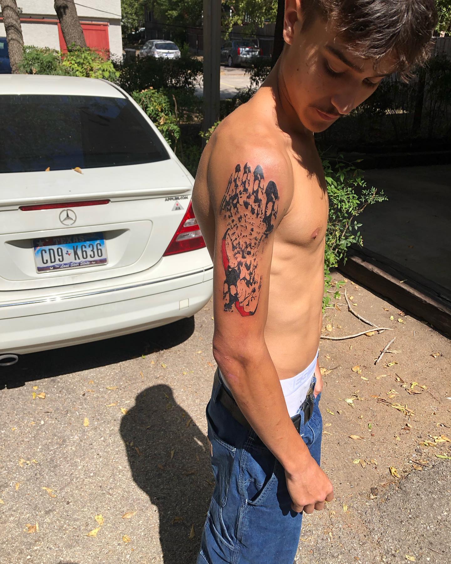 Crowd dotwork tattoo on the upper arm by @emotionalthugtattoo