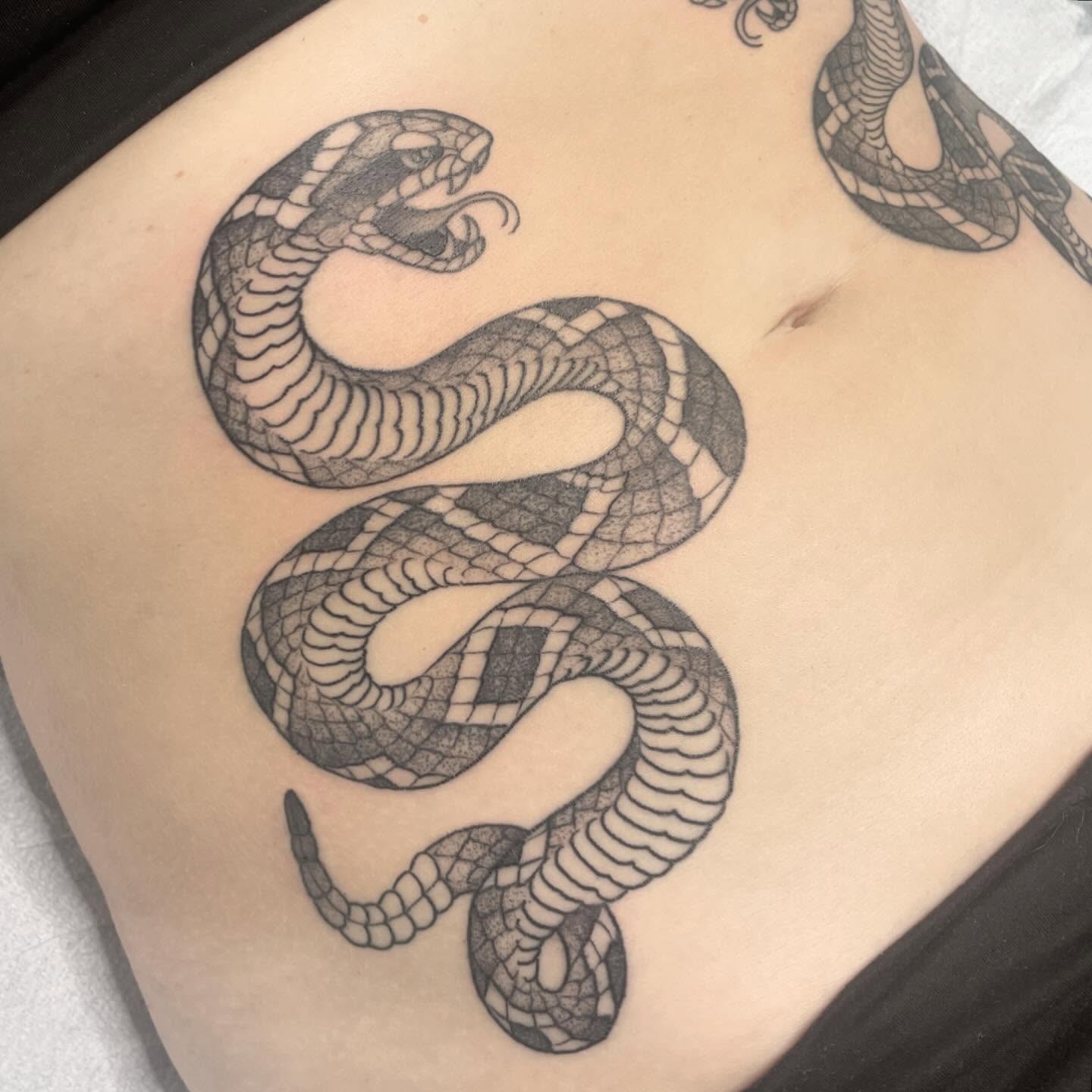 Snake black and grey tattoo on the ribs by Amanda Marie, Edmonds, Washington