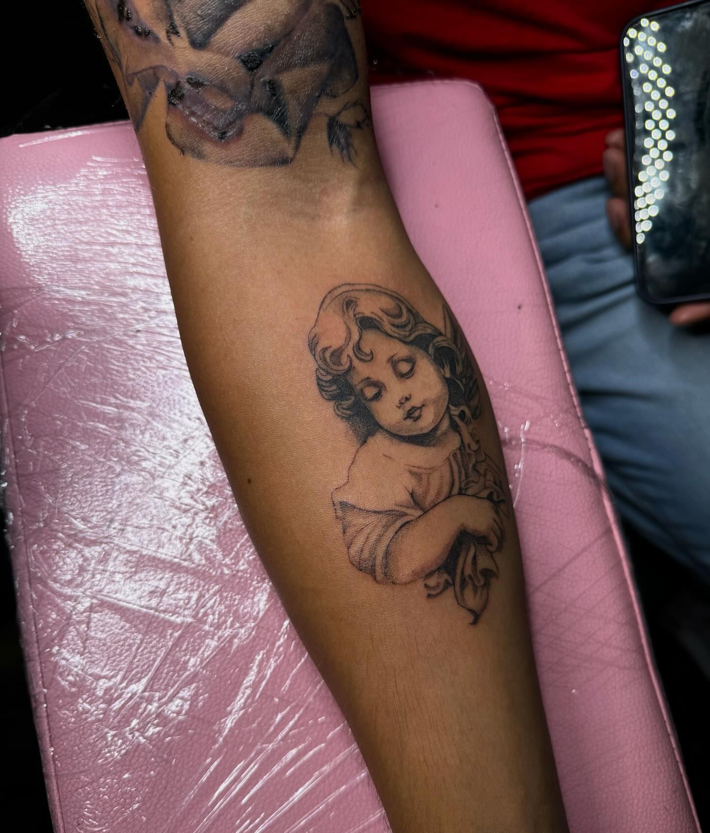 Angel black and grey tattoo on the forearm by V