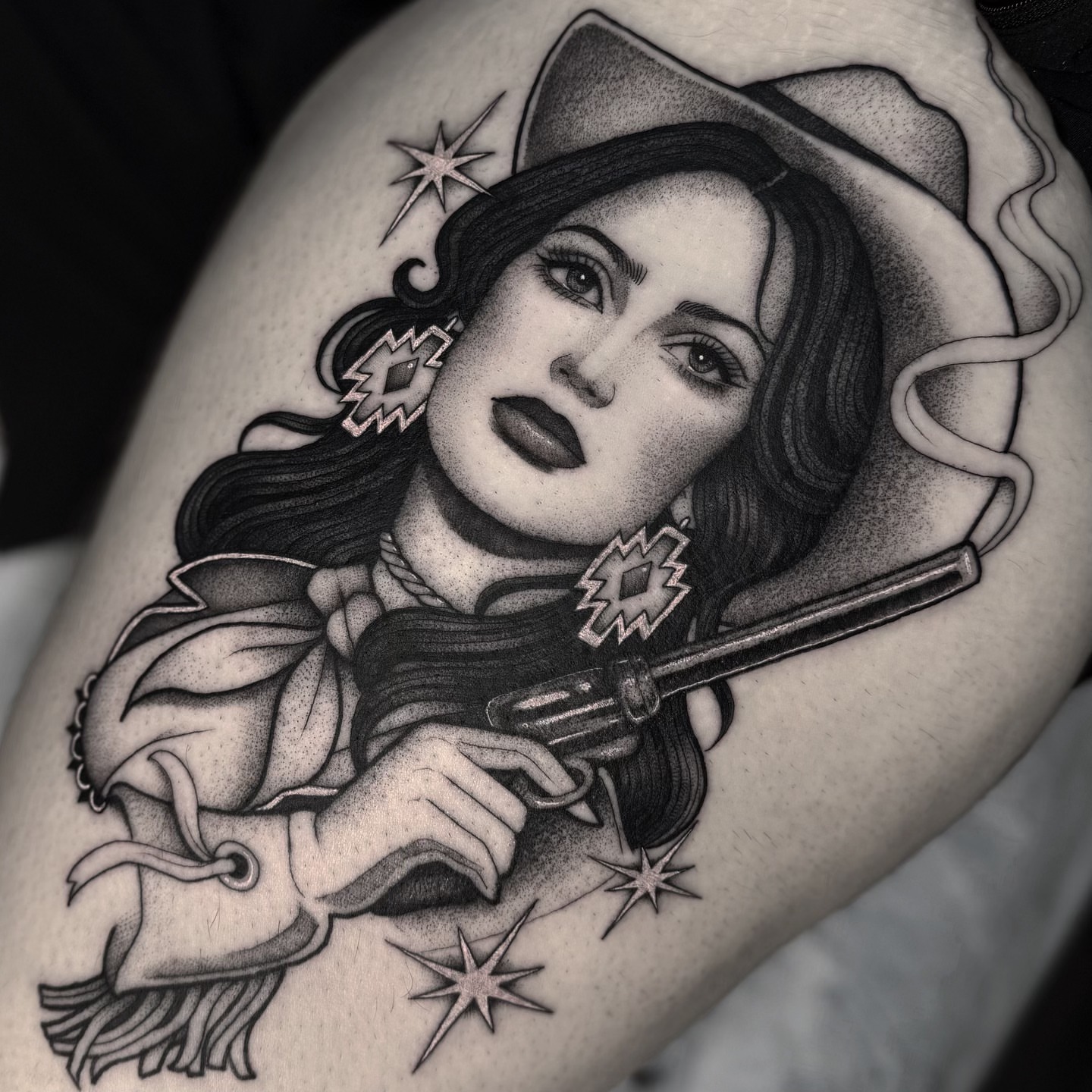 Cowgirl with revolver realism tattoo on the thigh by Luna Lucero