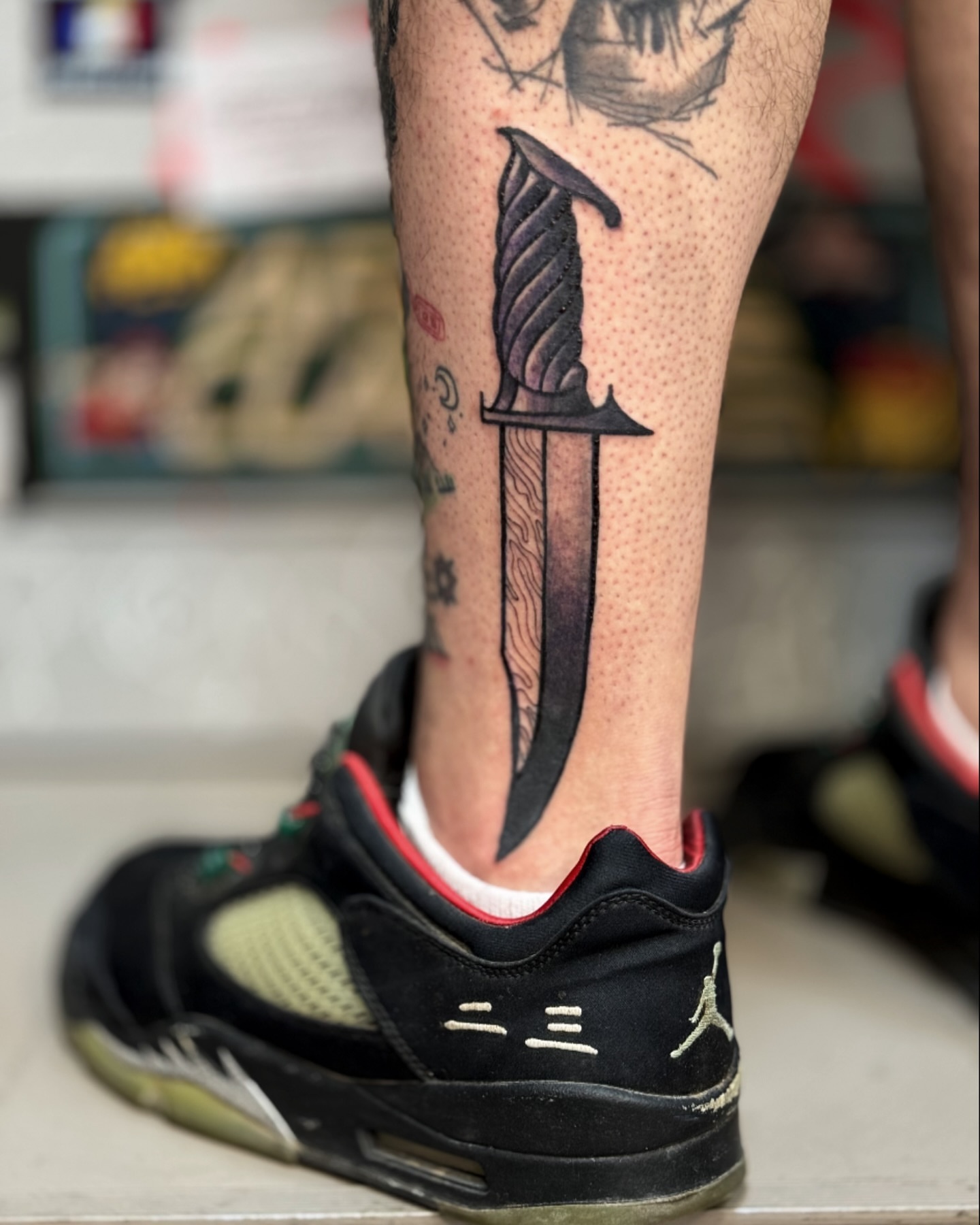 Knife black and grey tattoo on the calf by Comastein__________✍🏼️