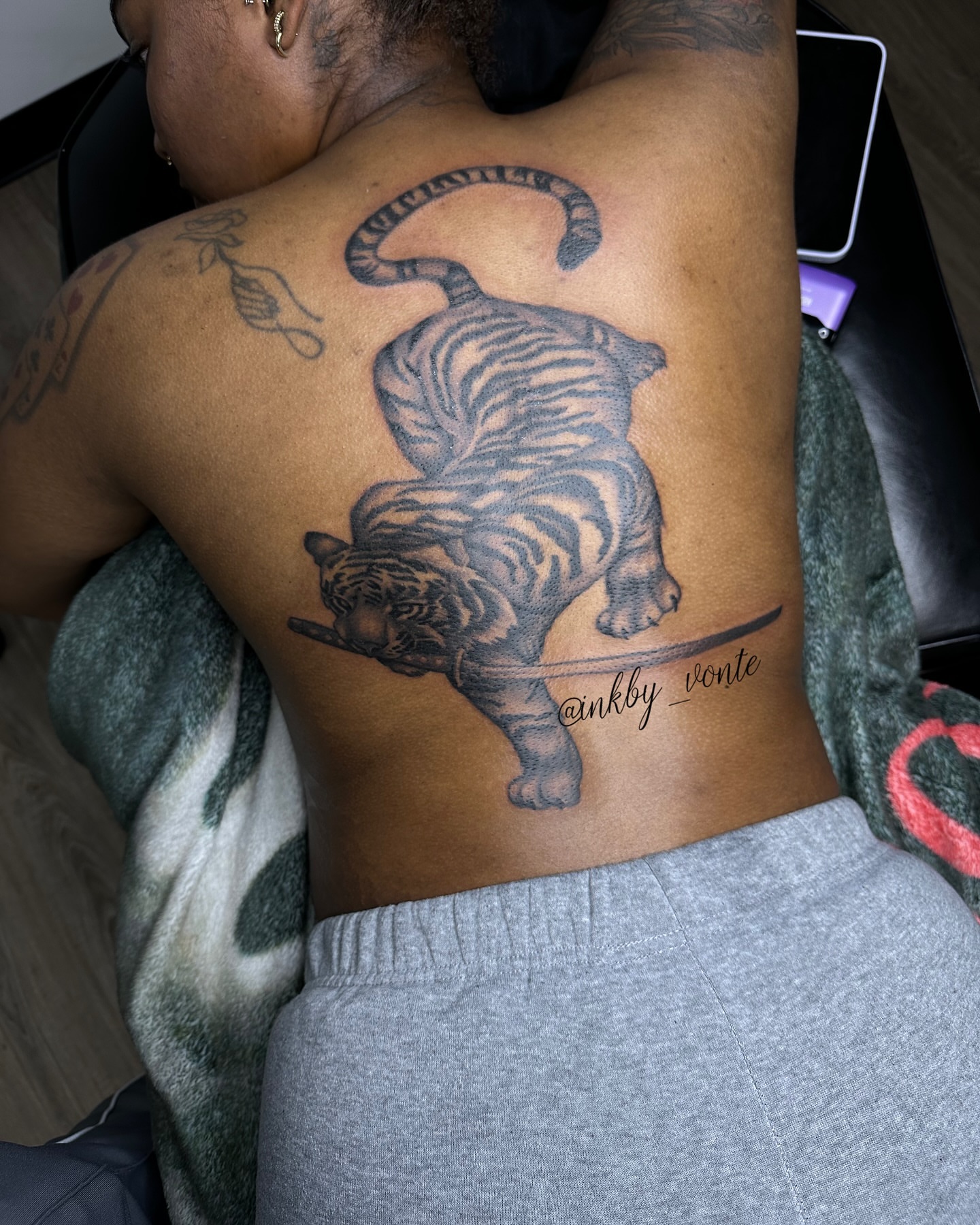 Tiger black and grey tattoo on the back by Vonte Seay