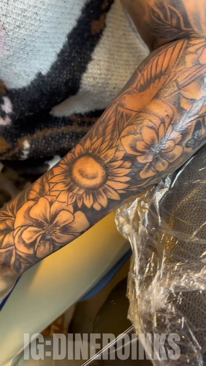Floral sleeve with sunflowers and roses realism tattoo by Dinero Inks