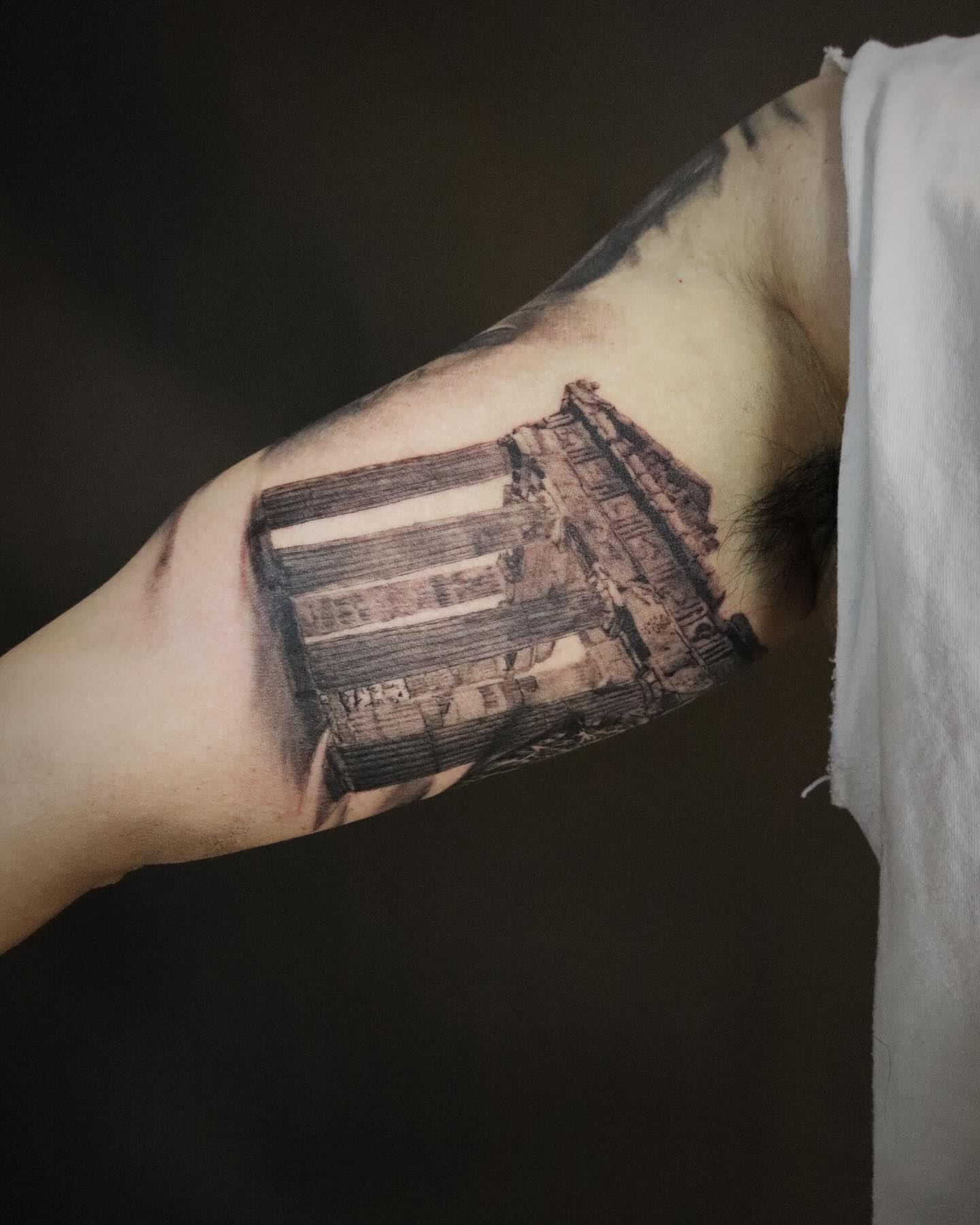 Ancient ruins realism tattoo on the forearm by Yu Chen