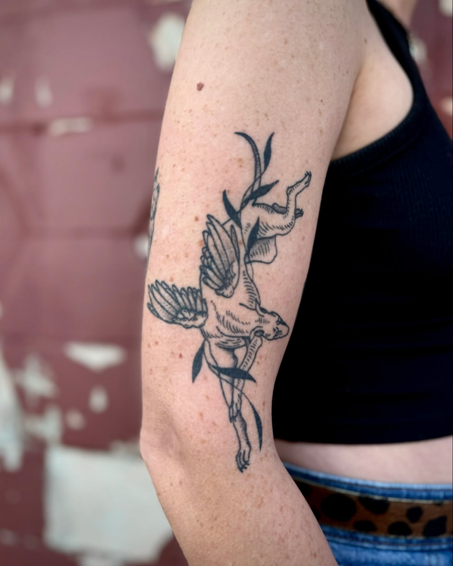 Bird and deer black and grey tattoo on the forearm by Mazie