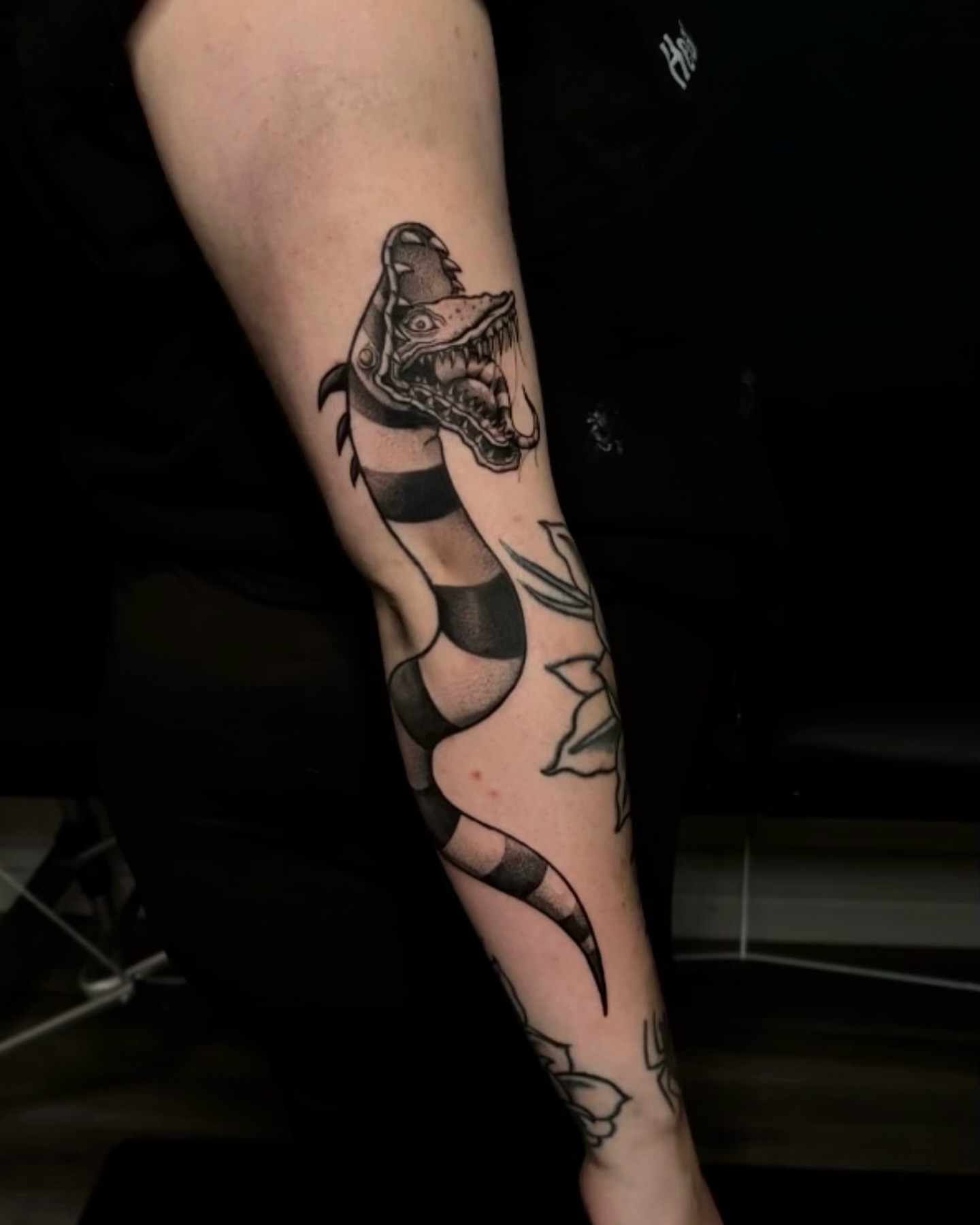 Dinosaur black and grey tattoo on the forearm by aleah 🌙
