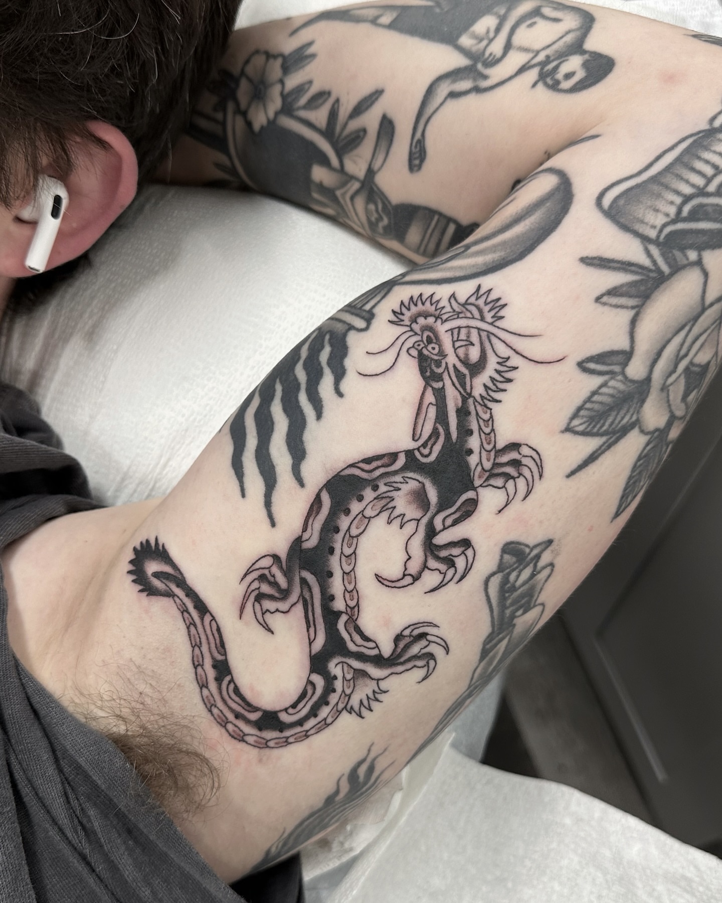 Dragon black and grey tattoo on the forearm by Nicholas Lee, San Francisco, California