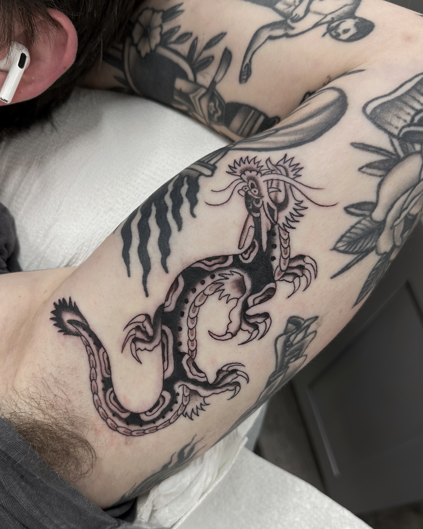 Dragon black and grey tattoo on the forearm by Nicholas Lee, San Francisco, California