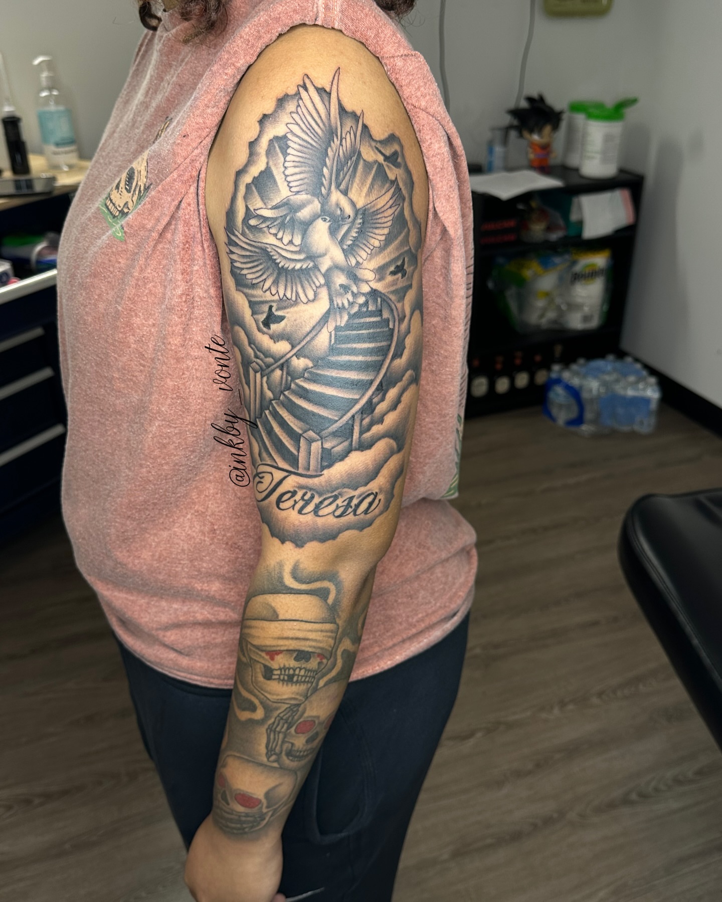Dove and staircase realism tattoo on the upper arm by Vonte Seay