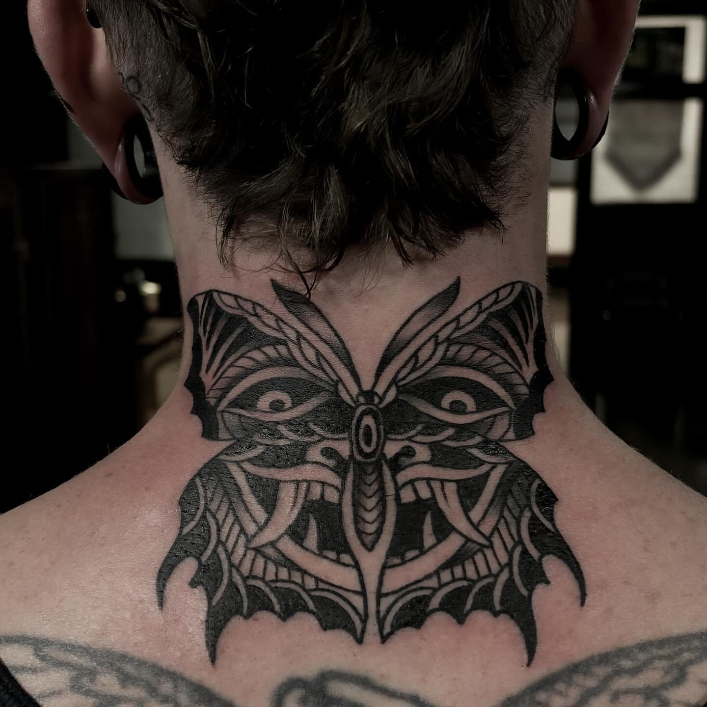Owl American traditional tattoo on the neck by Adam Underwood, Minneapolis, Minnesota