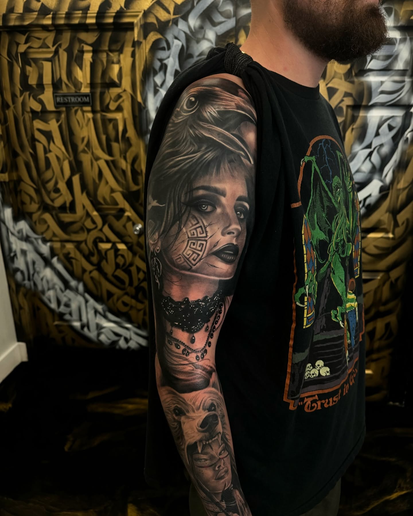 Woman with tribal face paint realism tattoo on the upper arm by Fernando Luna
