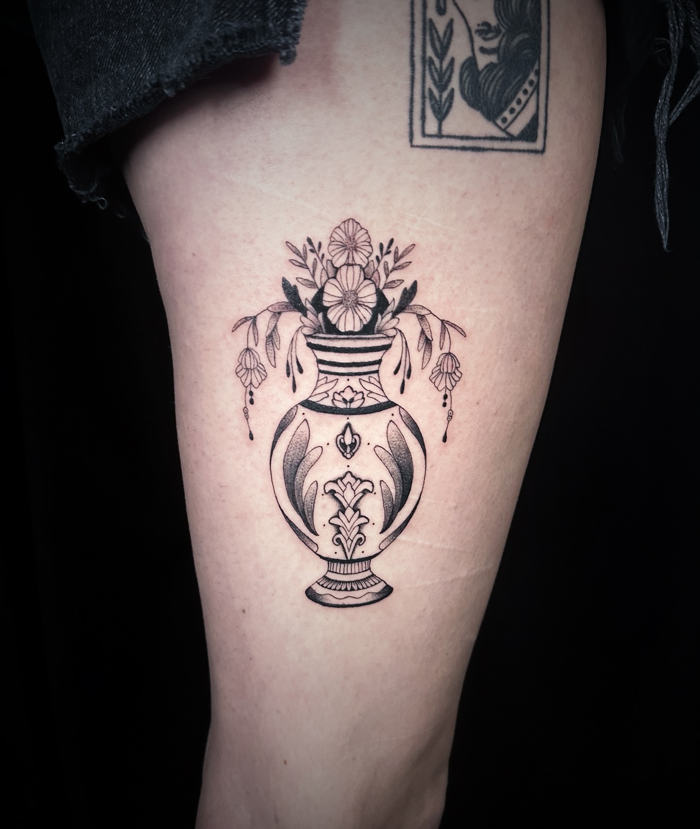 Vase with flowers black and grey tattoo on the thigh by 🕸 ᴠɪᴠɪᴀɴ ʟᴏʀᴇ 🕸, Nashville, Tennessee