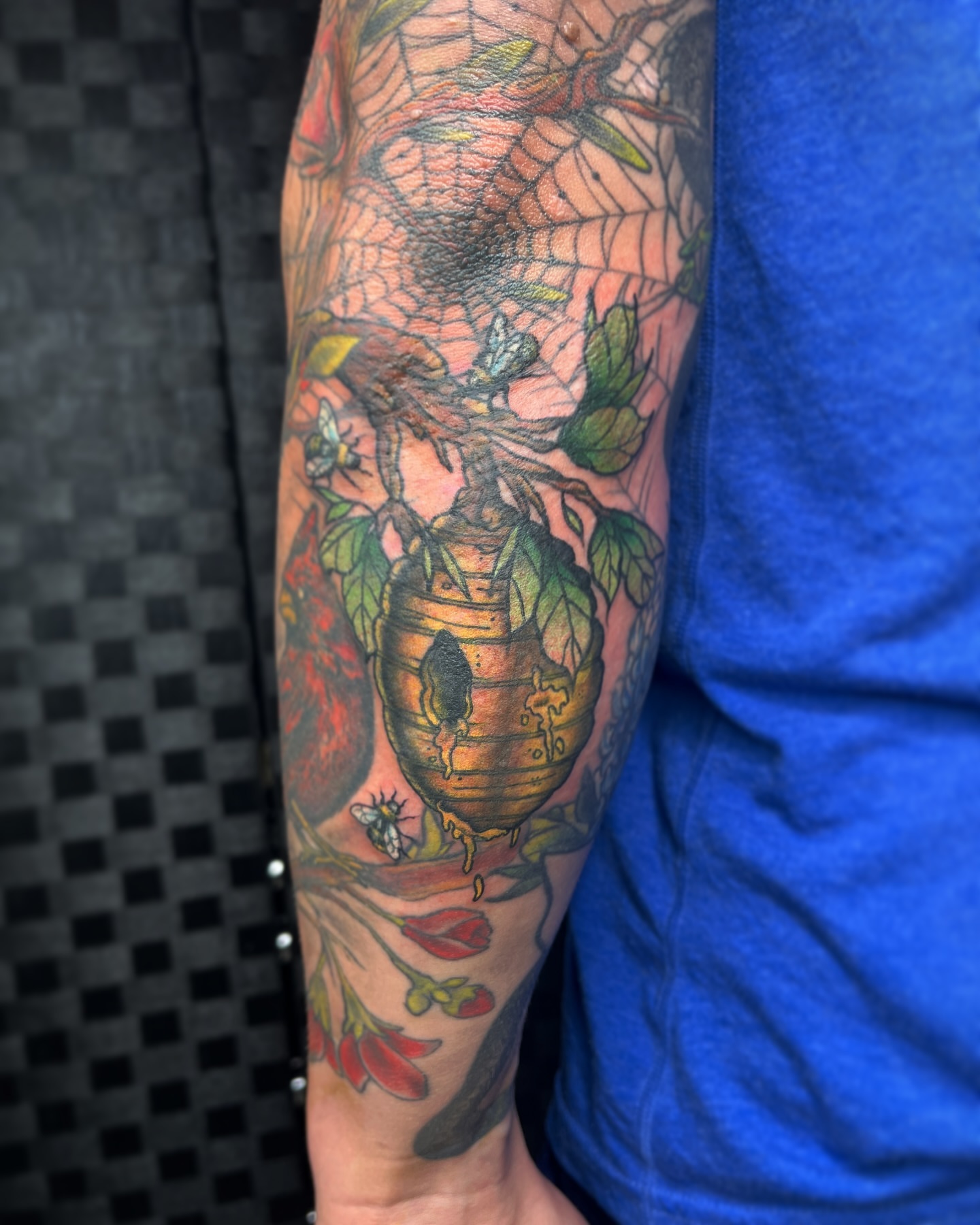 Bee hive with botanical elements neo-traditional tattoo on the forearm by ✩ 🕯️☾༺♰ gracey ༻☽🕯️✩