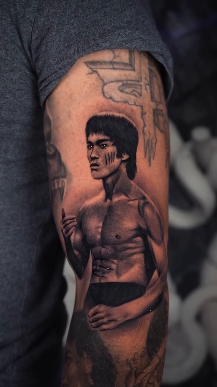 Bruce Lee portrait realism tattoo by Fernando Andrade Jr