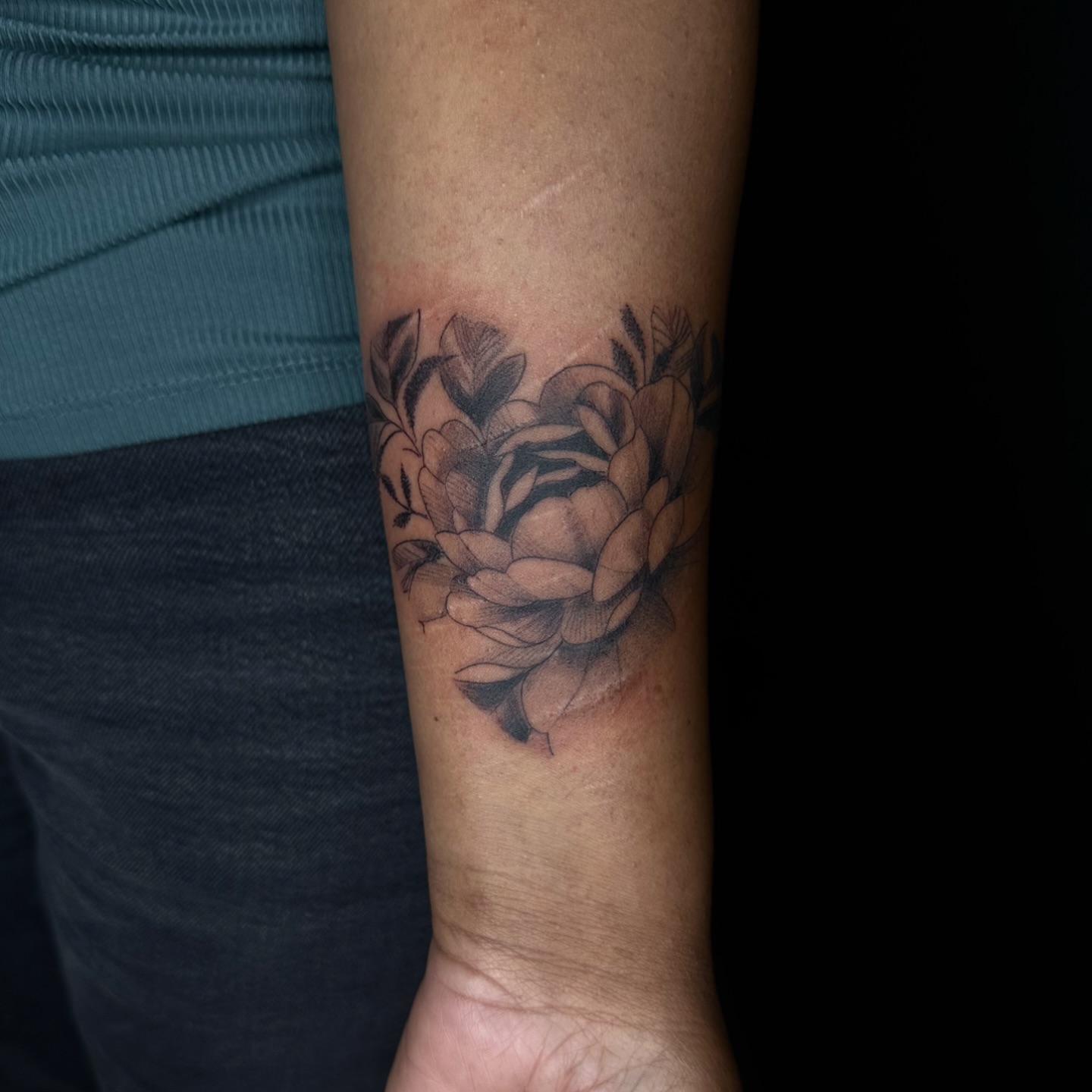 Flower black and grey tattoo on the forearm by Jay Morales