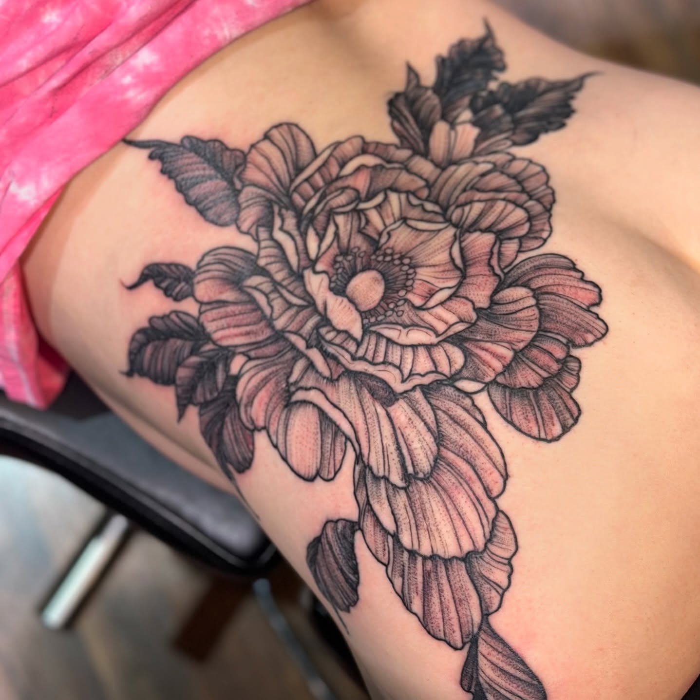 Peony black and grey tattoo on the thigh by Benjamin Carlson