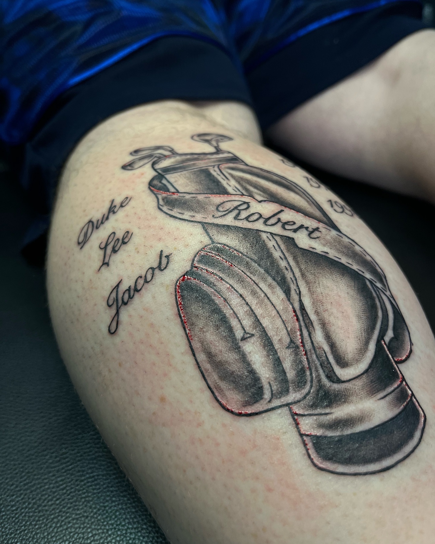 Baseball glove black and grey tattoo on the thigh by Connor Arvay