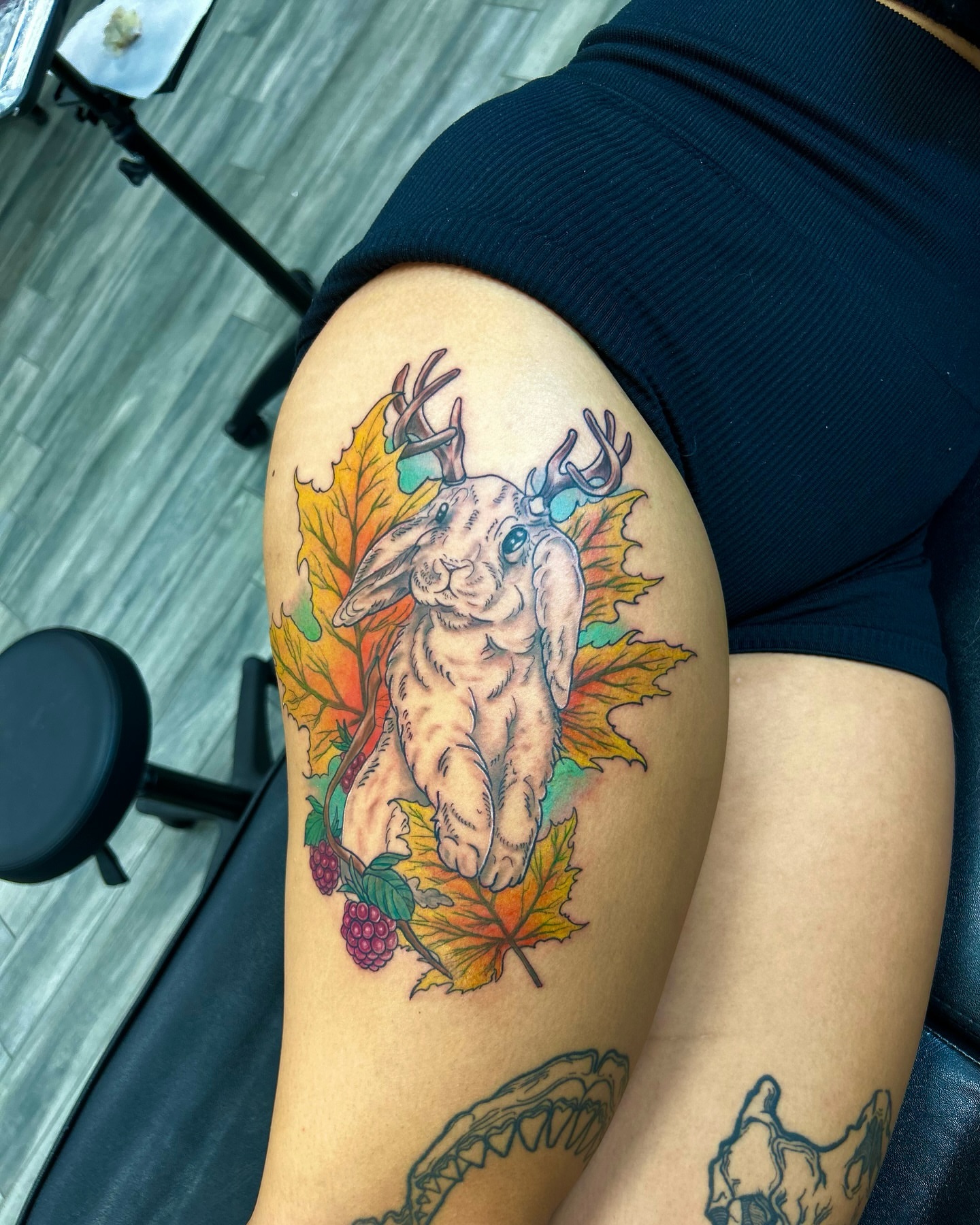 Deer and leaves realism tattoo on the thigh by Brittany Brutal