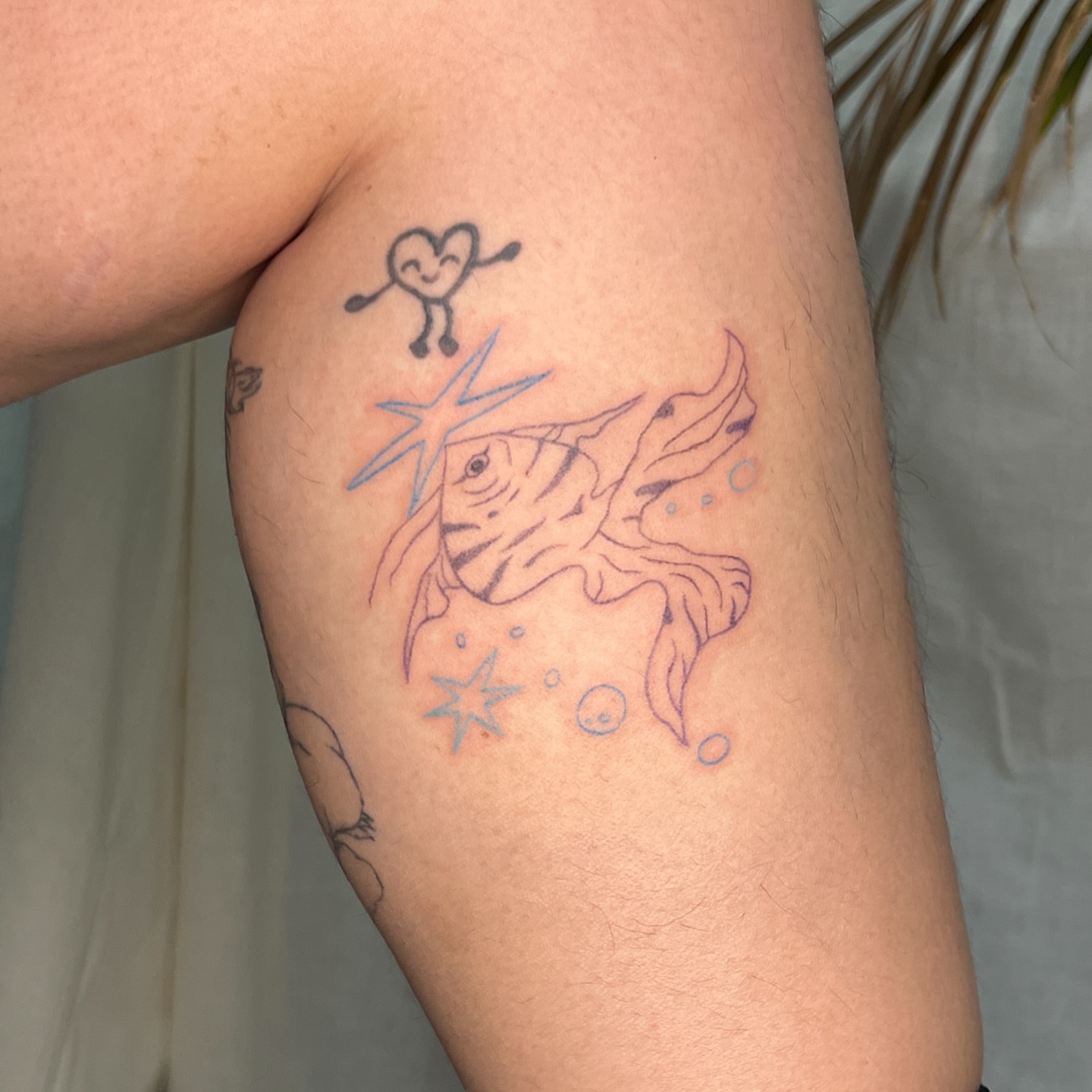 Fish and heart new school tattoo on the forearm by Charlie