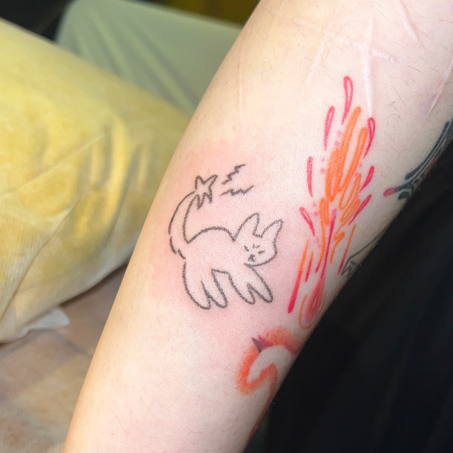 Cat minimalist tattoo on the forearm by Charlie