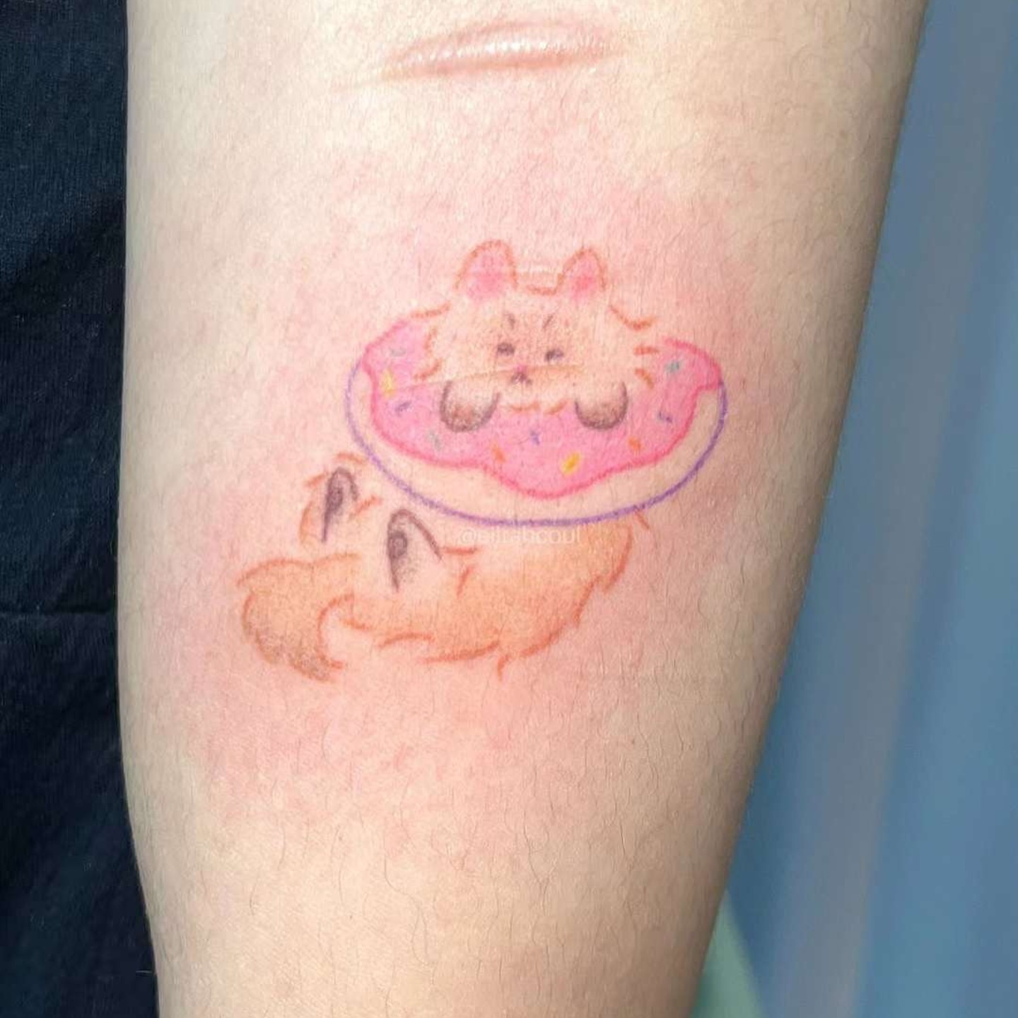 Cat with donut dotwork tattoo on the forearm by Charlie