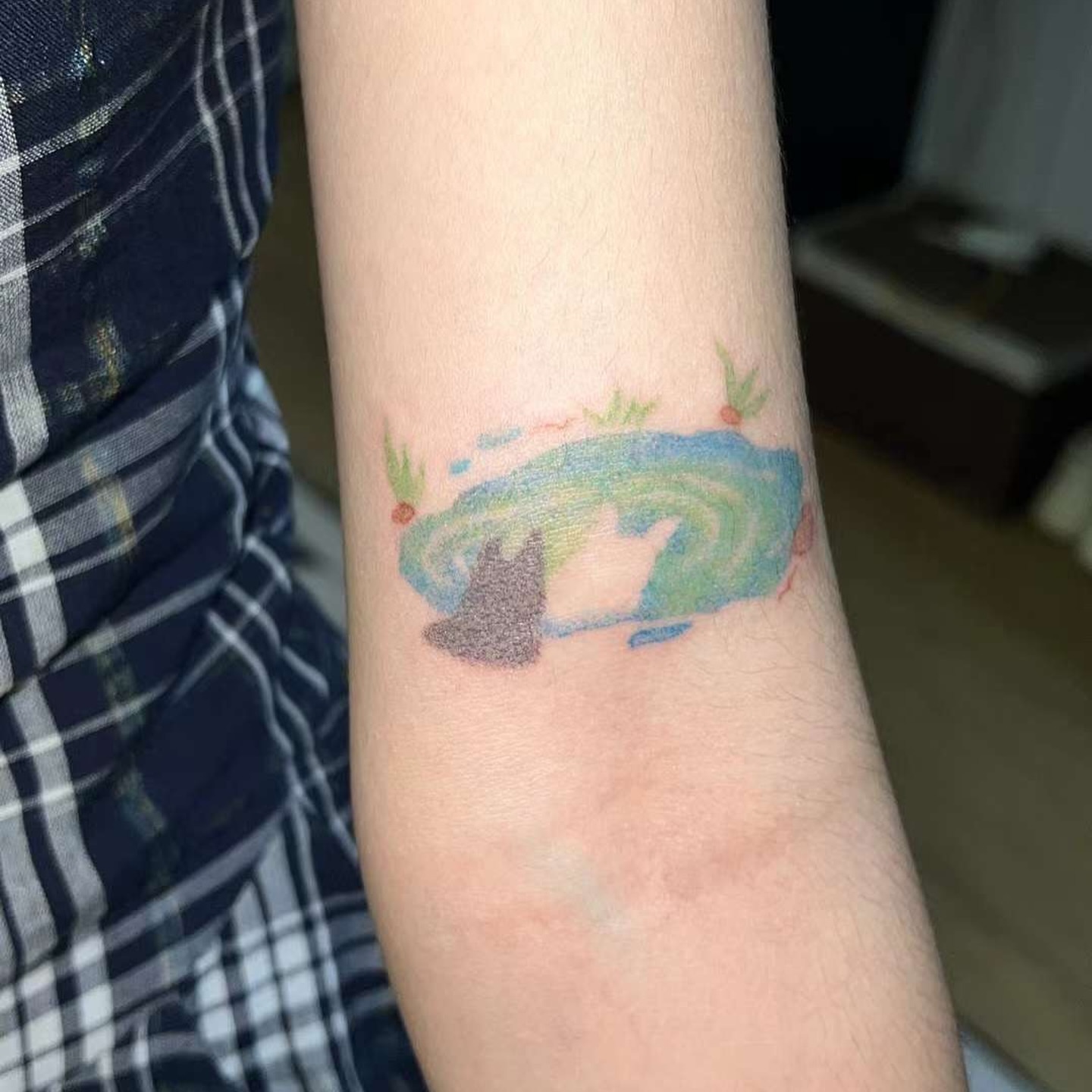 Cat and pond dotwork tattoo on the forearm by Charlie