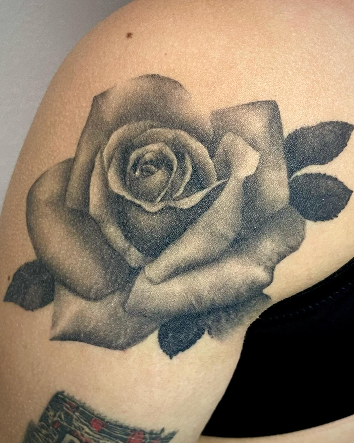 Rose realism tattoo on the shoulder by Bryce Presley, Mission, Kansas