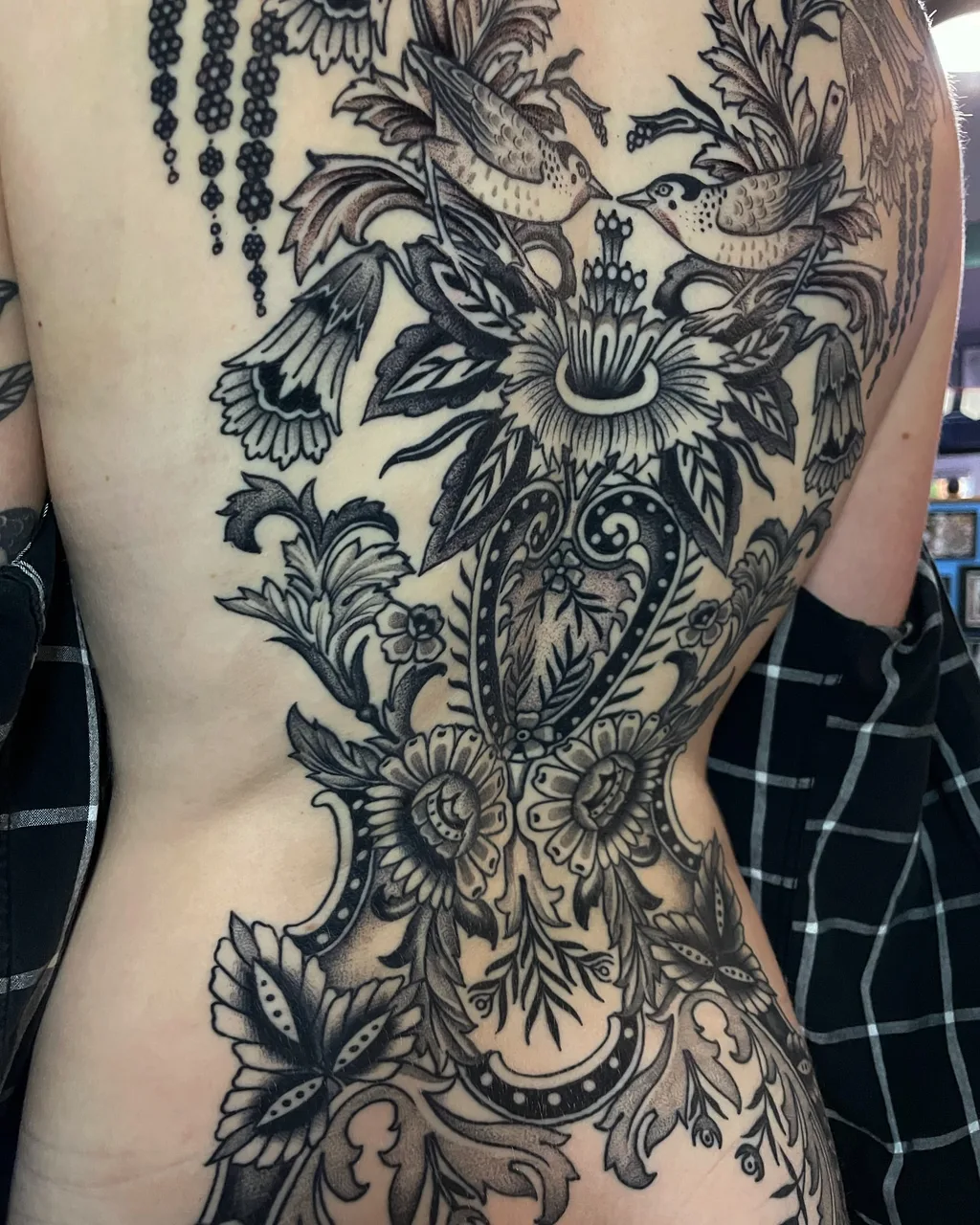 Floral arrangement ornamental tattoo on the back by Lauren Vandevier