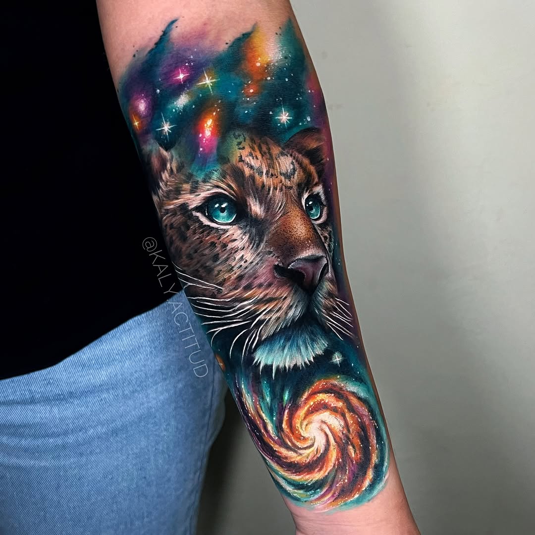 Leopard in space realism tattoo on the forearm by Kaly, Manhattan, NYC