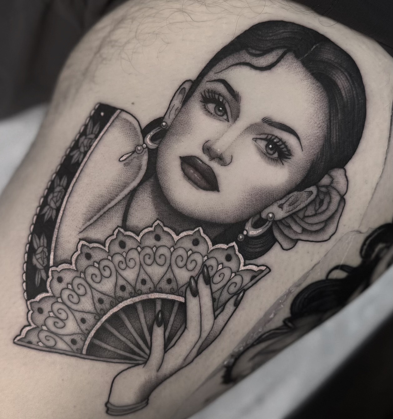 Woman with fan realism tattoo on the shoulder by Luna Lucero