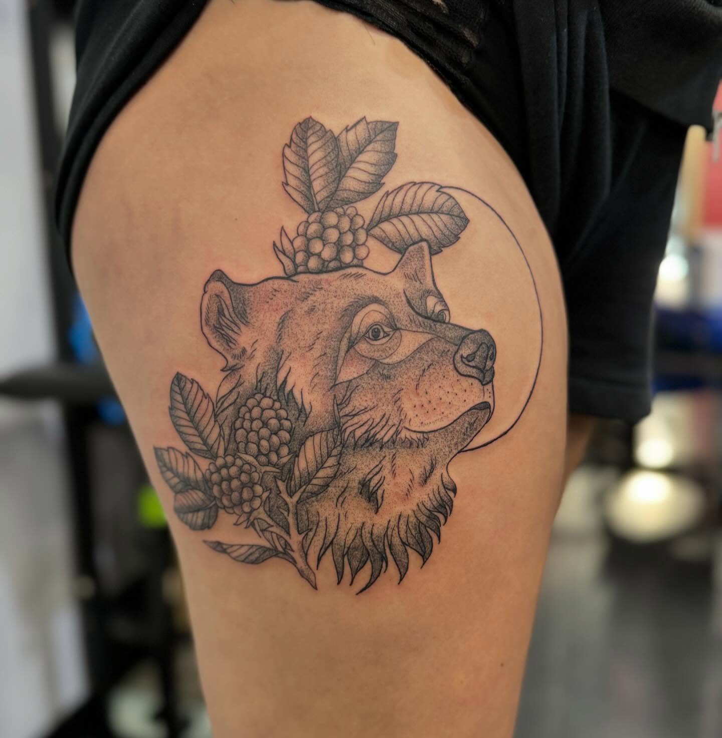 Bear and berries dotwork tattoo on the thigh by Marissa Losier