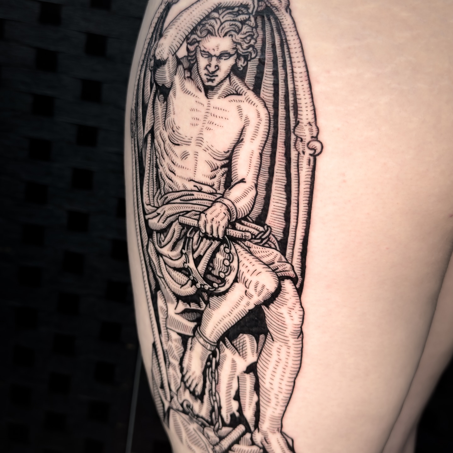 Angel black and grey tattoo on the upper arm by Dokk