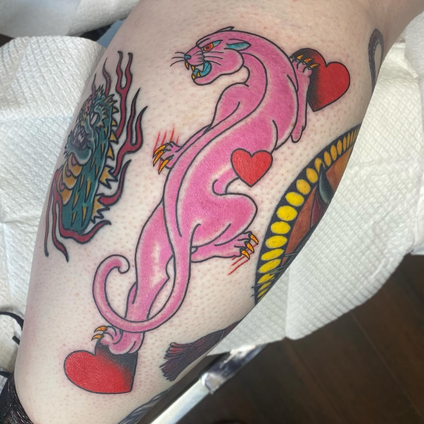 Pink panther American traditional tattoo on the thigh by Jacie Aasen-Lupino